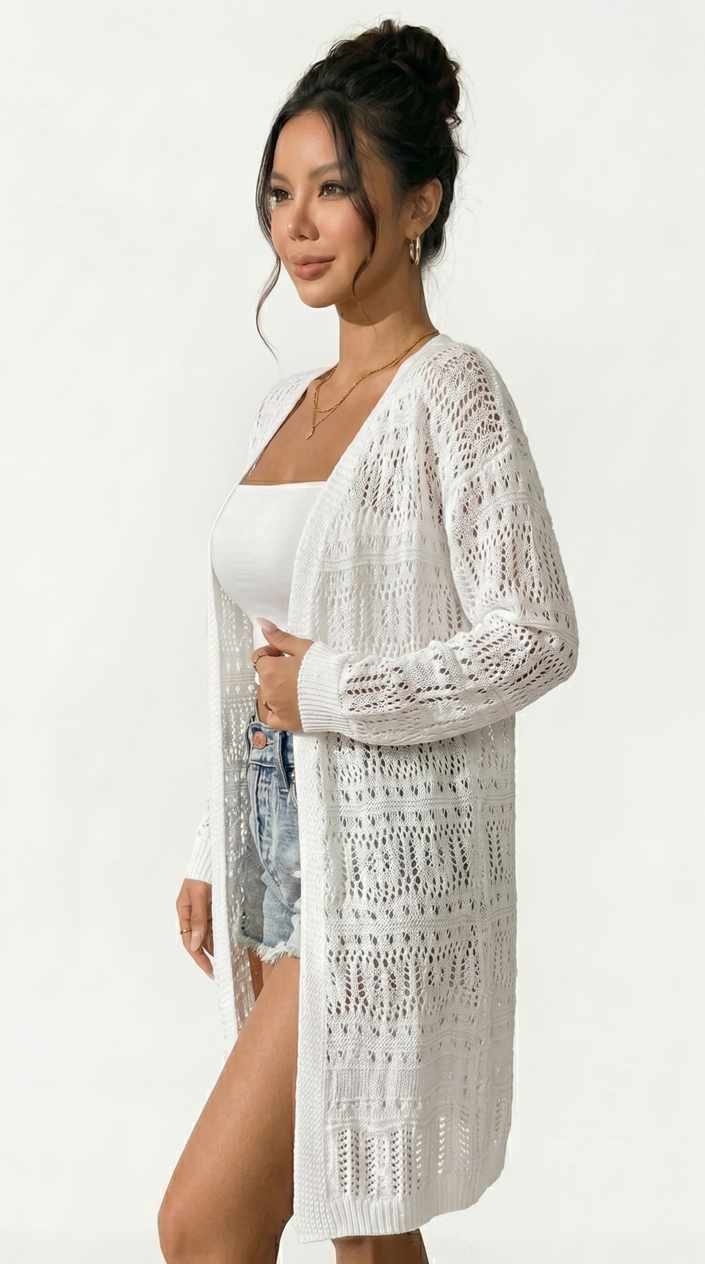 Woman wearing a white crochet cover-up on a white background from Meleche  USA or Meléche (short as (Mé))