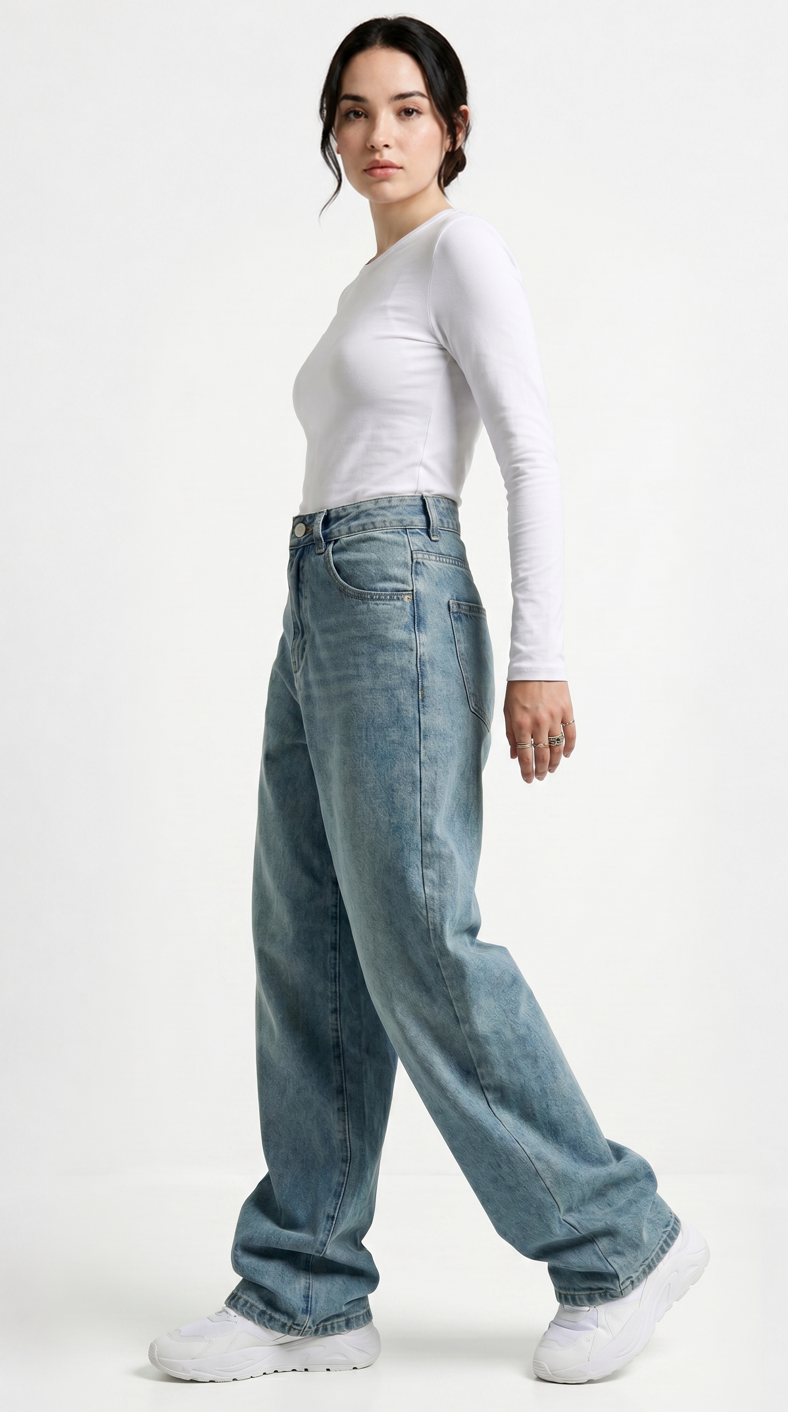 Person wearing a white long-sleeve shirt and blue jeans on a white background, Relaxed Fit Egyptian cotton jeans from Meleche Fashion USA or Meléche (short as (Mé))