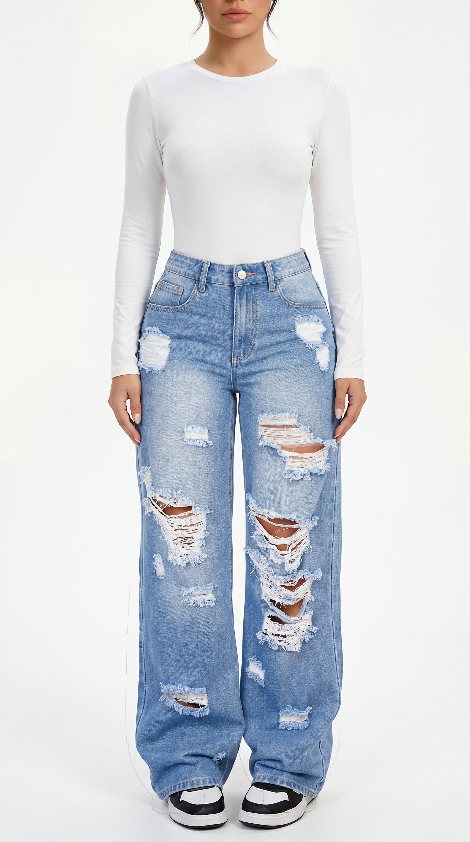 Person wearing a white long-sleeve top and distressed blue jeans on a white background, Wide-leg jeans from Meleche Fashion USA or Meléche (short as (Mé))