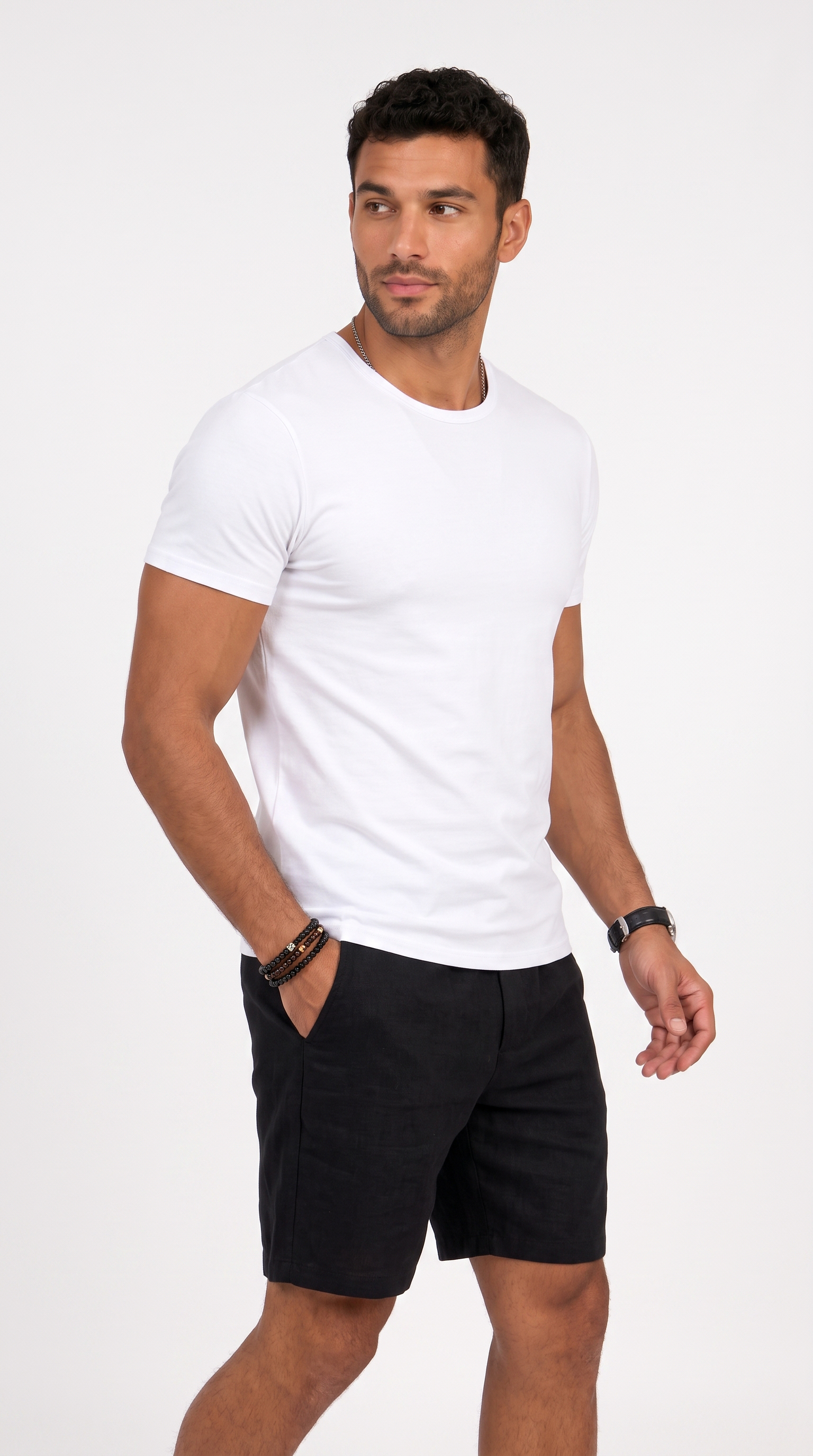 A man wearing a white short-sleeve crewneck t-shirt and black shorts, standing against a plain white studio background, from Meleche Fashion USA or Meléche (short as (Mé))