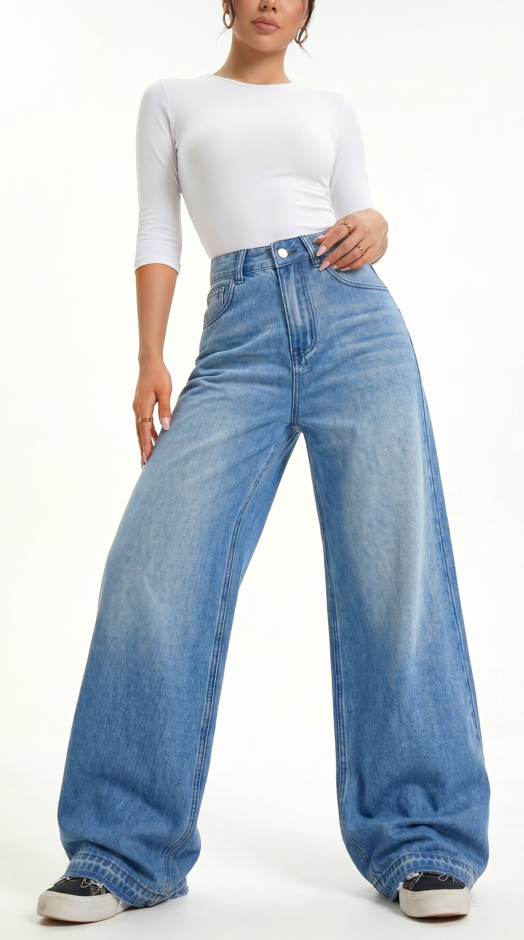 Person wearing a white top and blue wide-leg jeans on a white background, Wide-leg Egyptian Cotton jeans from Meleche Fashion USA or Meléche (short as (Mé))