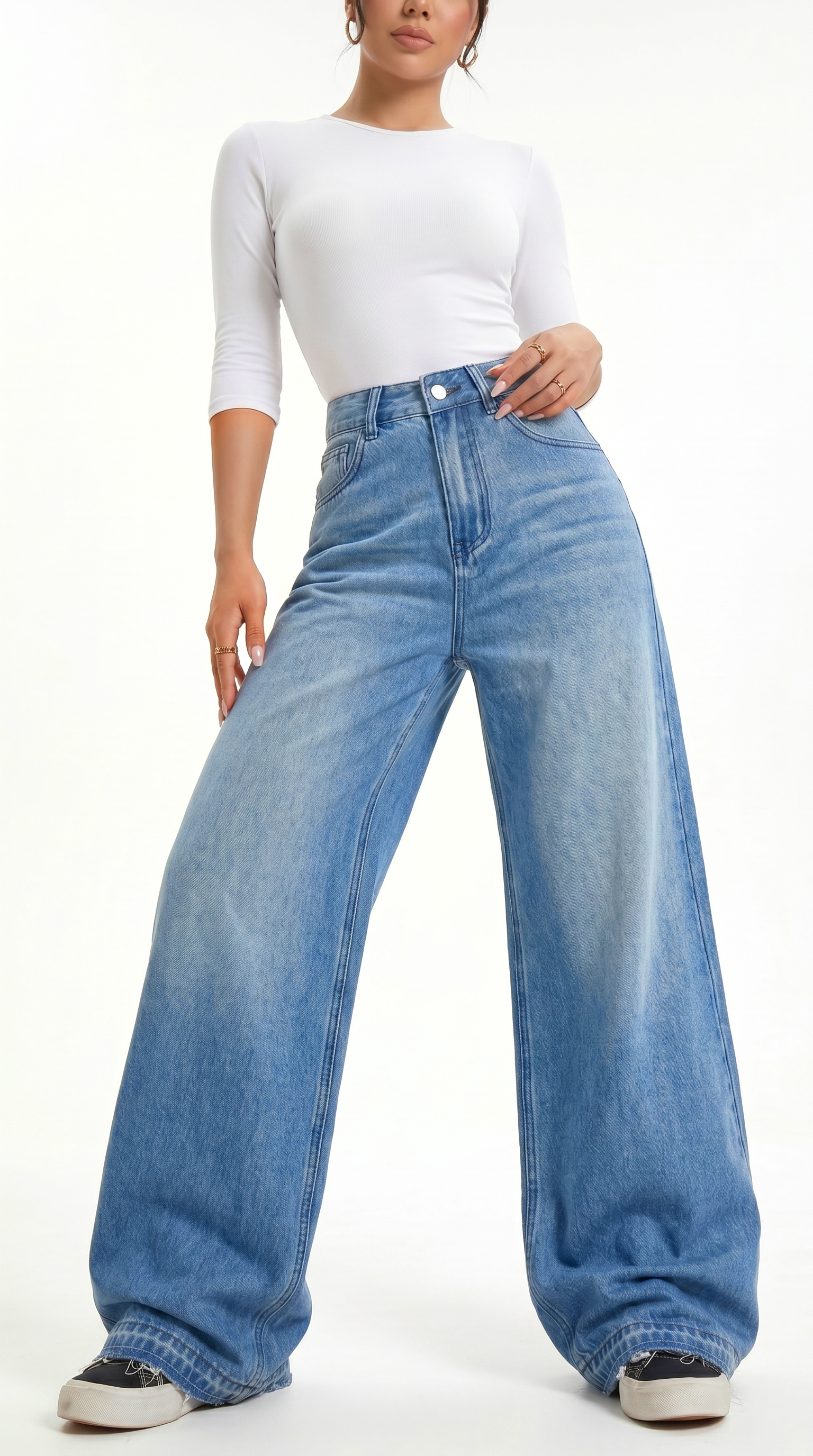 Person wearing a white top and blue wide-leg jeans on a white background, Wide-leg Egyptian Cotton jeans from Meleche Fashion USA or Meléche (short as (Mé))