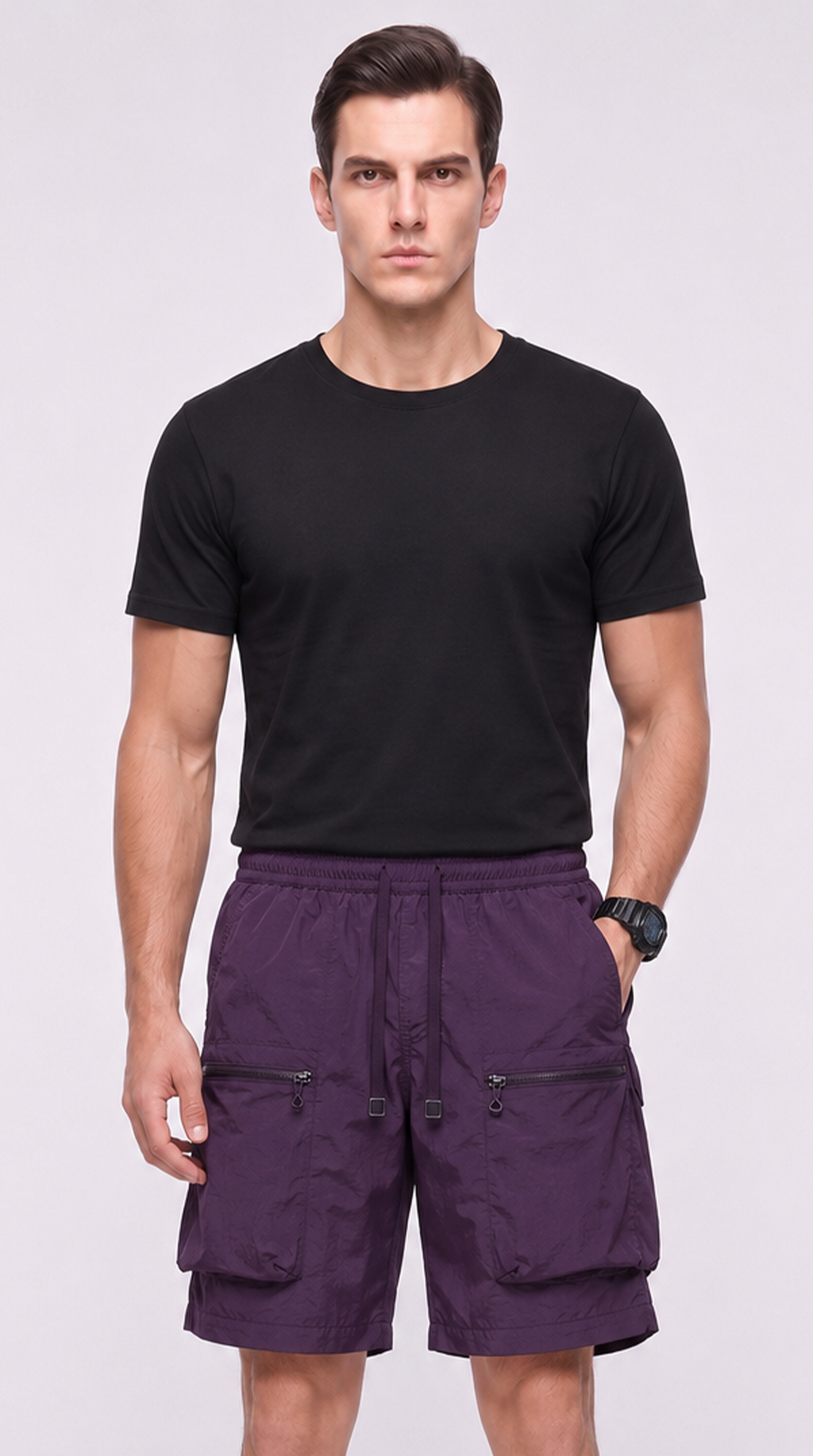 A man modeling a black short-sleeve crewneck t-shirt and purple cargo shorts against a light gray studio background, from Meleche Fashion USA or Meléche (short as (Mé))