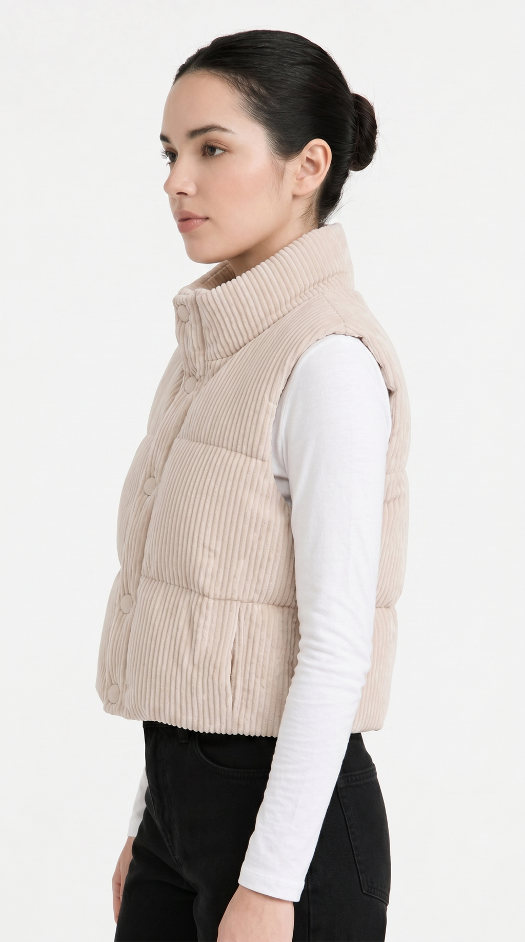 Woman wearing a beige quilted vest on a white background from Meleche Fashion USA or Meléche (short as (Mé))