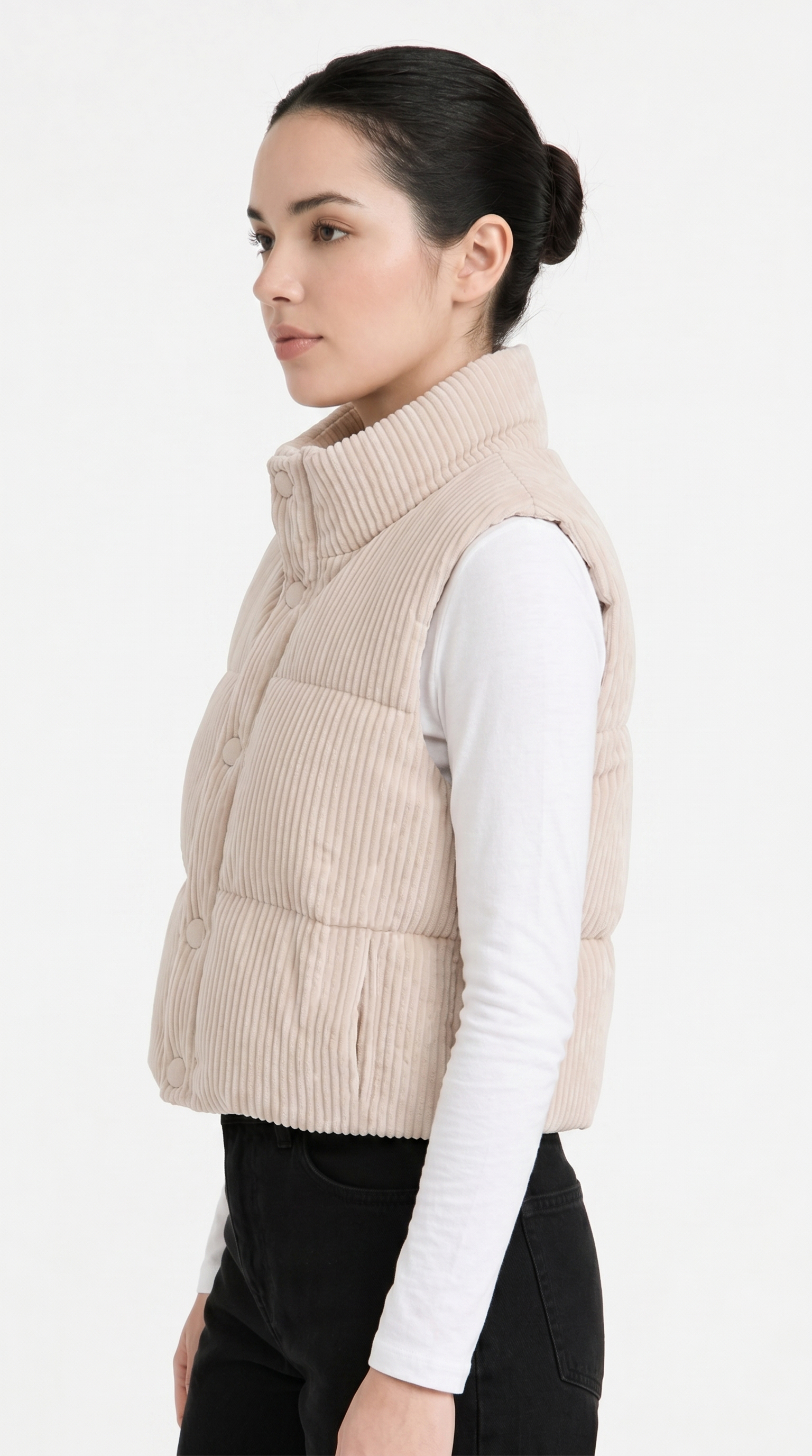 Woman wearing a beige quilted vest on a white background from Meleche Fashion USA or Meléche (short as (Mé))