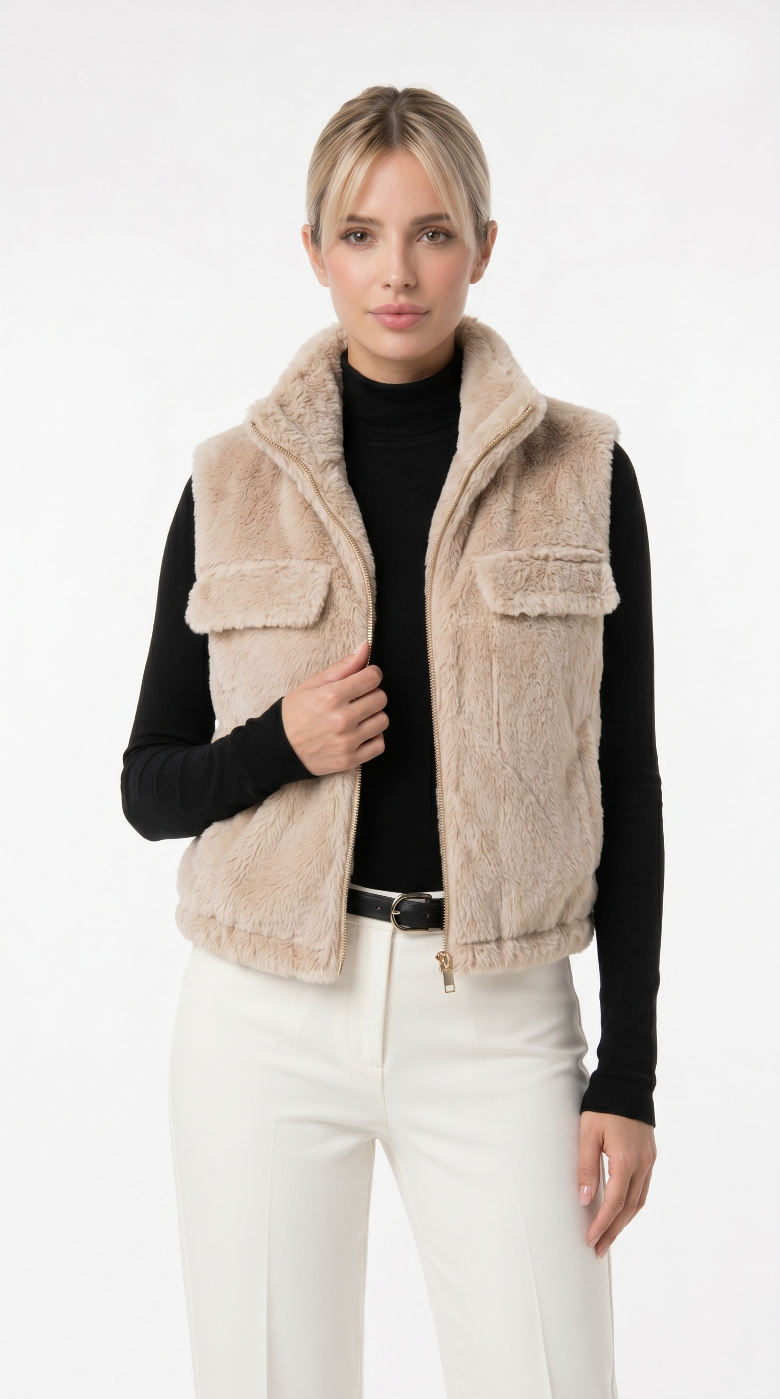 Woman wearing a beige fleece vest over a black long-sleeve shirt and white pants on a white background from Meleche Fashion USA or Meléche (short as (Mé))