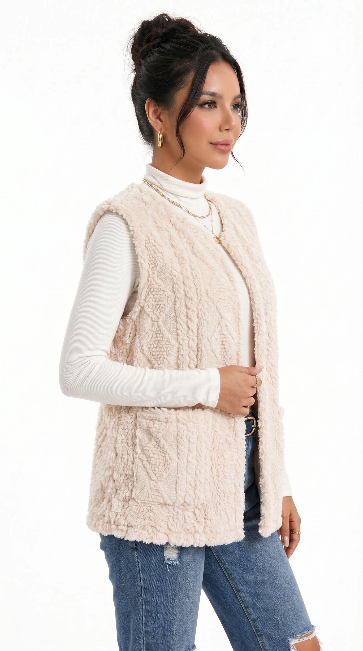Woman wearing a beige cable knit vest over a white long-sleeve shirt and blue jeans on a white background from Meleche Fashion USA or Meléche (short as (Mé))