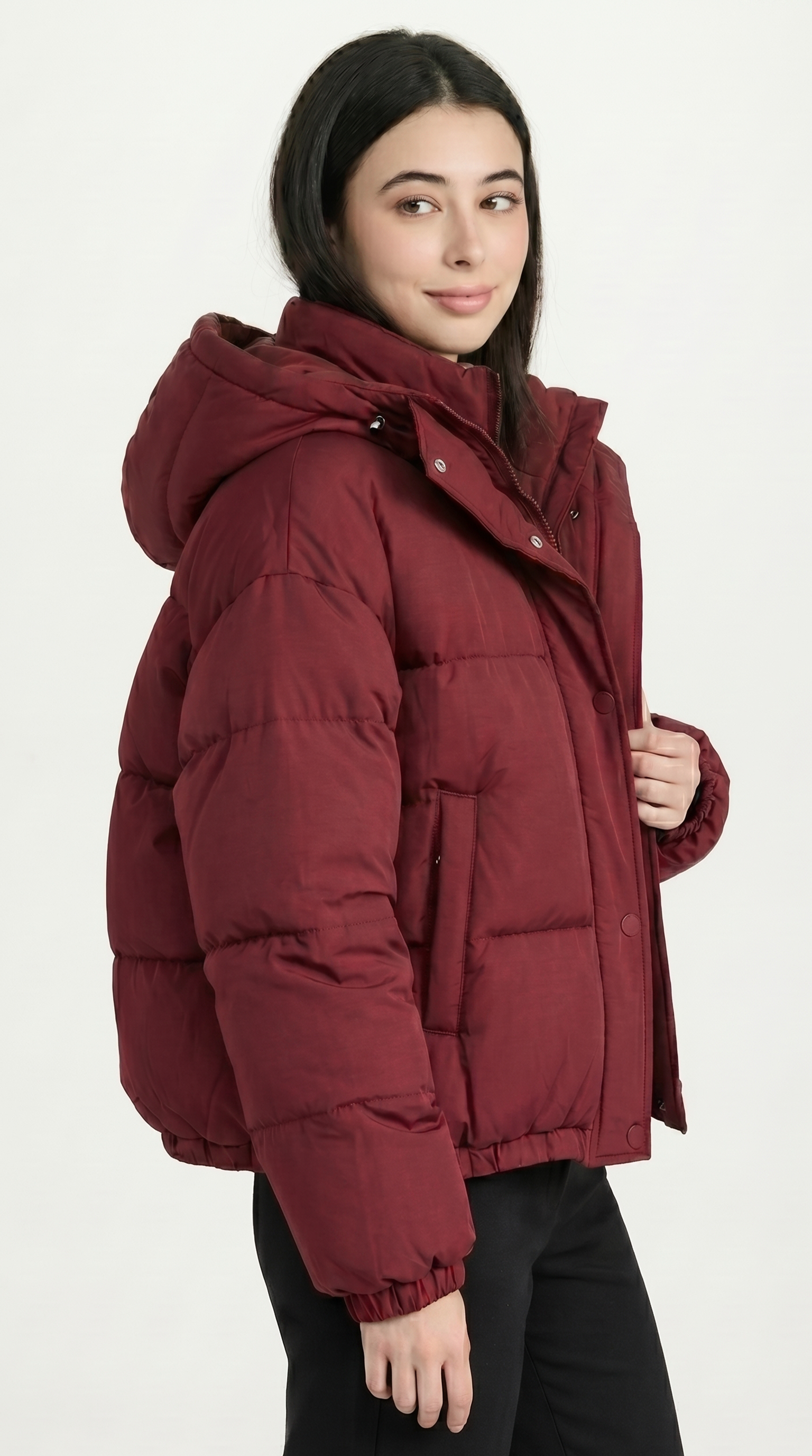 Person wearing a maroon puffer jacket on a white background from Meleche or Meléche USA (short as (Mé))