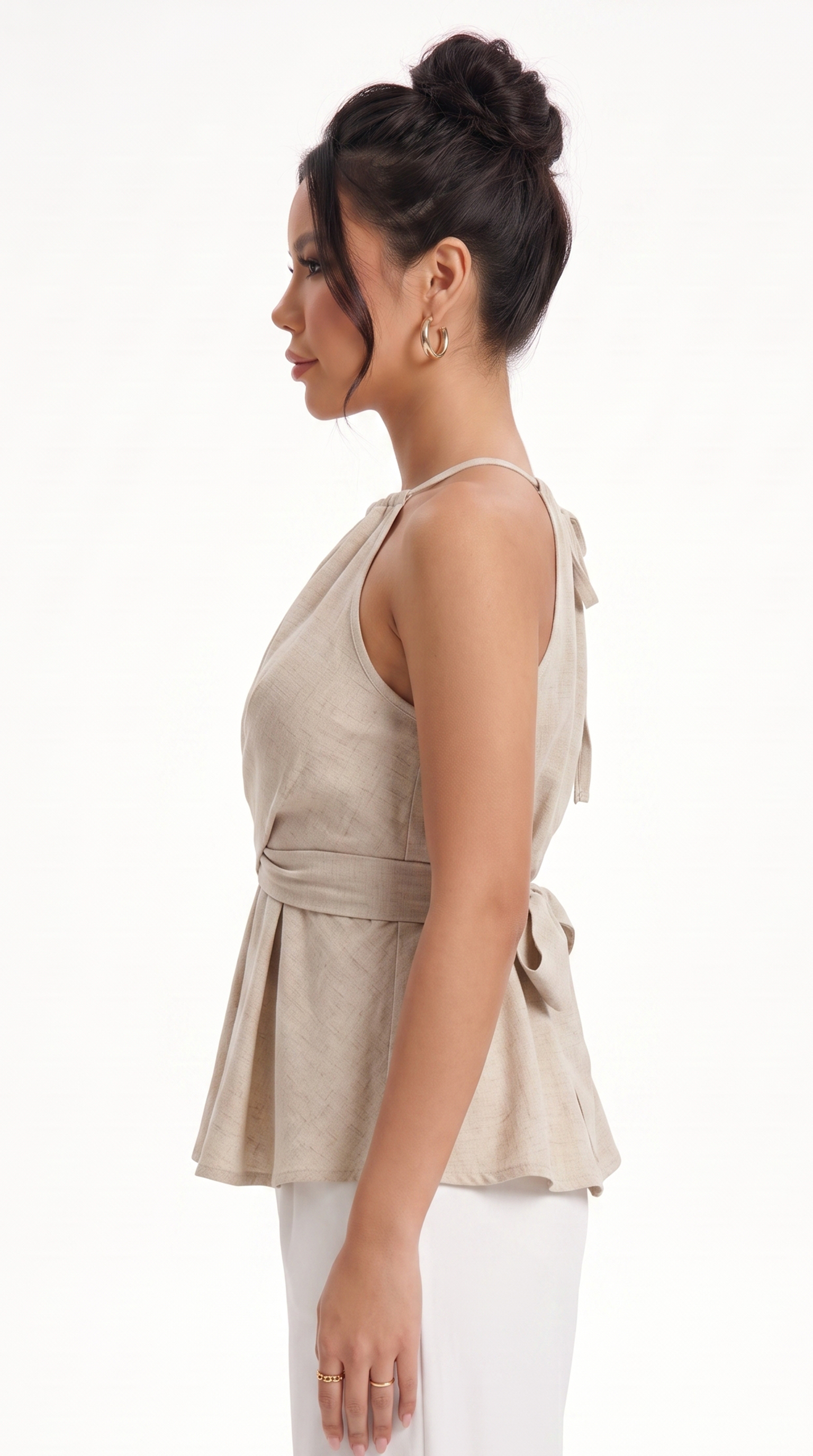 girl wearing Beige halter top with a tied front on a white background, from Meleche Fashion USA or Meléche (short as (Mé))