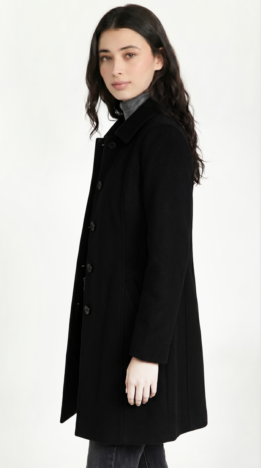 Woman wearing a black coat on a white background from Meleche or Meléche USA (short as (Mé))