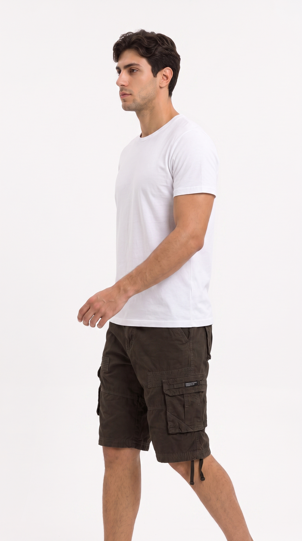 A man wearing a white crew-neck t-shirt and dark brown cargo shorts, shown in profile against a plain white studio background, from Meleche Fashion USA or Meléche (short as (Mé))