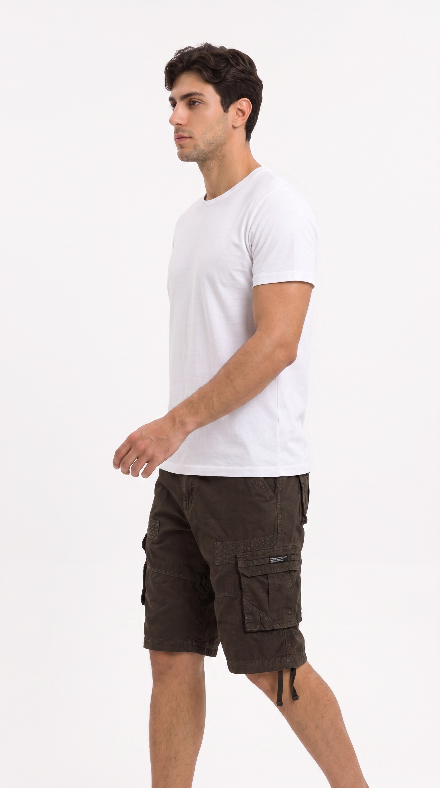 A man wearing a white crew-neck t-shirt and dark brown cargo shorts, shown in profile against a plain white studio background, from Meleche Fashion USA or Meléche (short as (Mé))