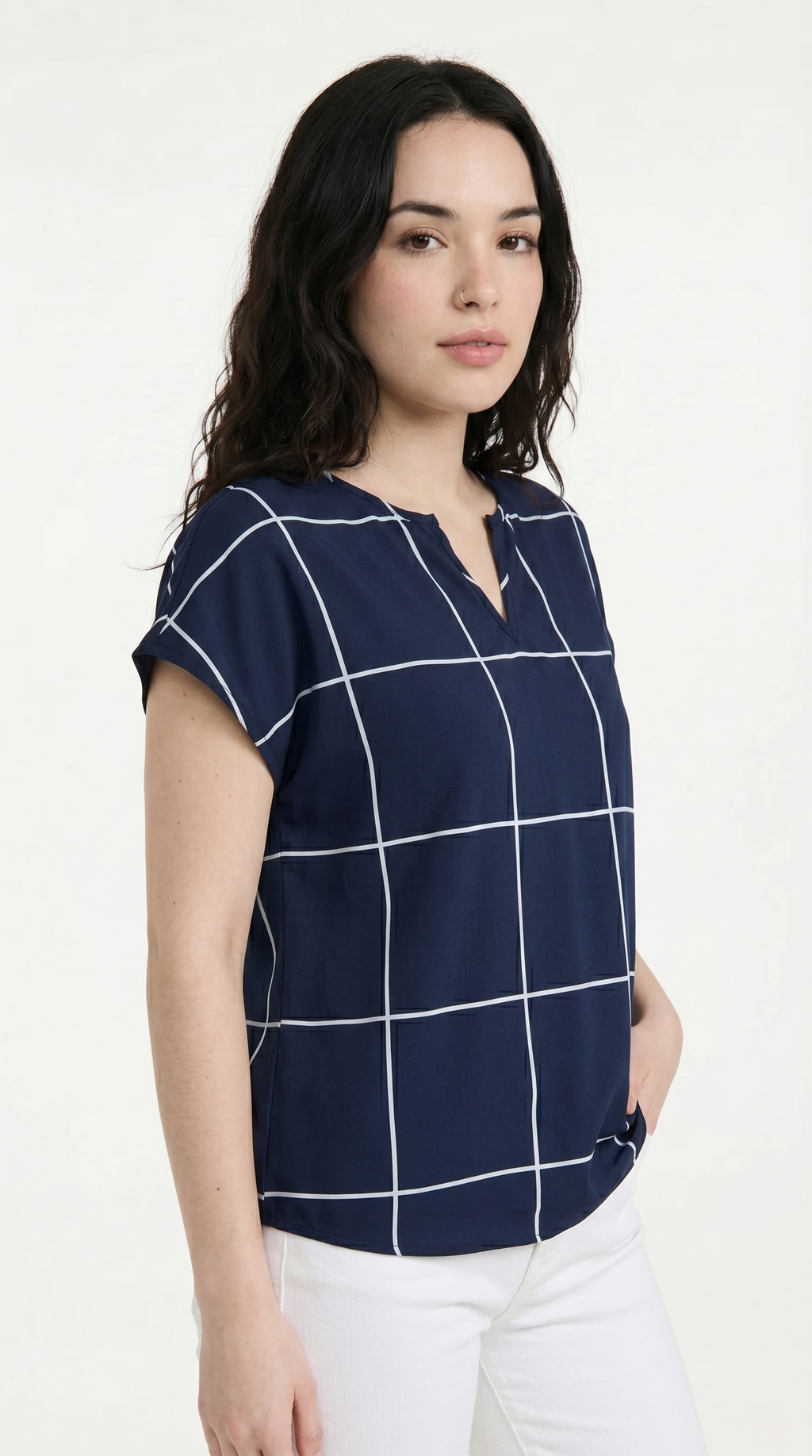 Woman wearing a navy blue shirt with white grid pattern on a white background, from Meleche Fashion USA or Meléche (short as (Mé))