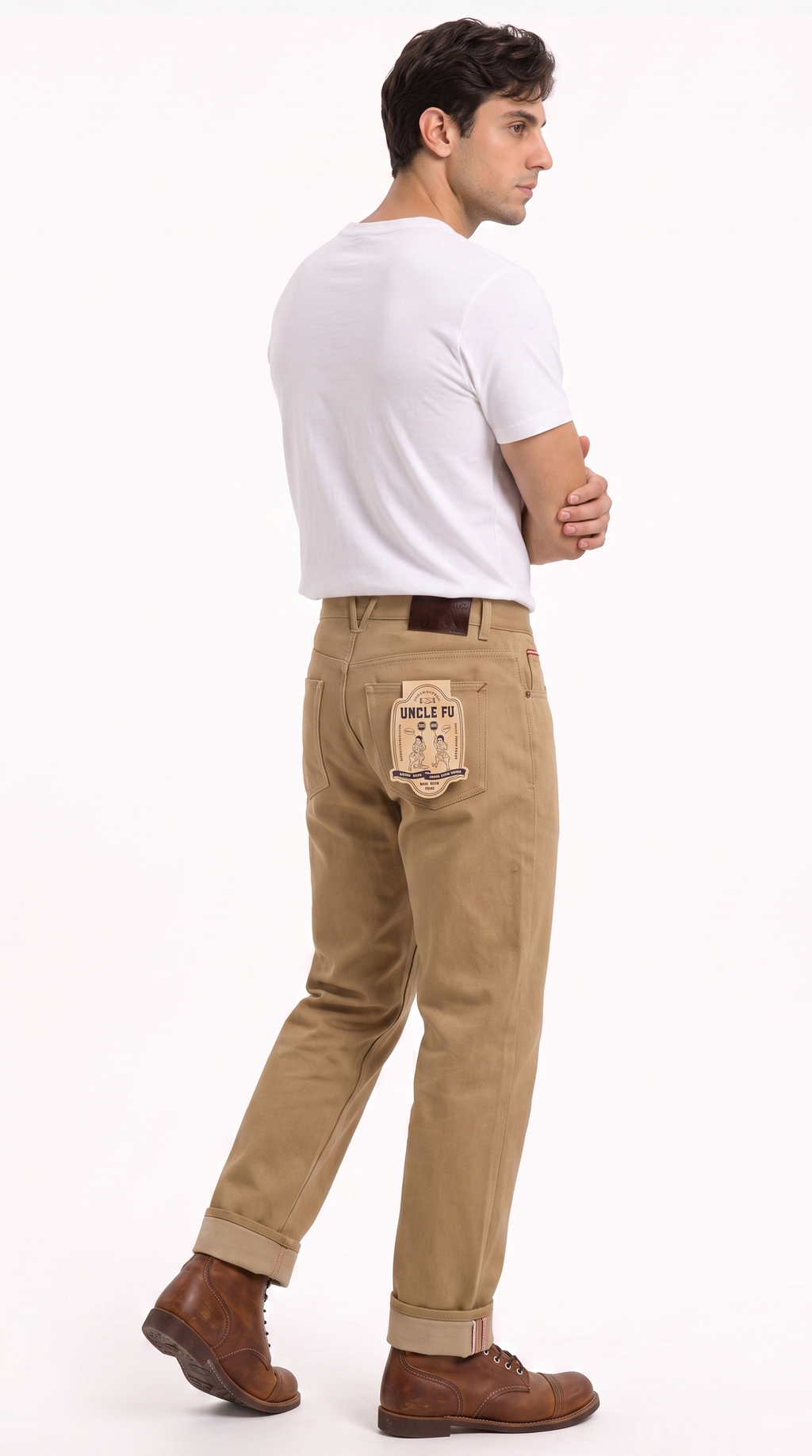 A man shown from the back wearing khaki pants with a distinctive patch on the back pocket, a white t-shirt, and brown boots, against a plain white background, from Meleche Fashion USA or Meléche (short as (Mé))