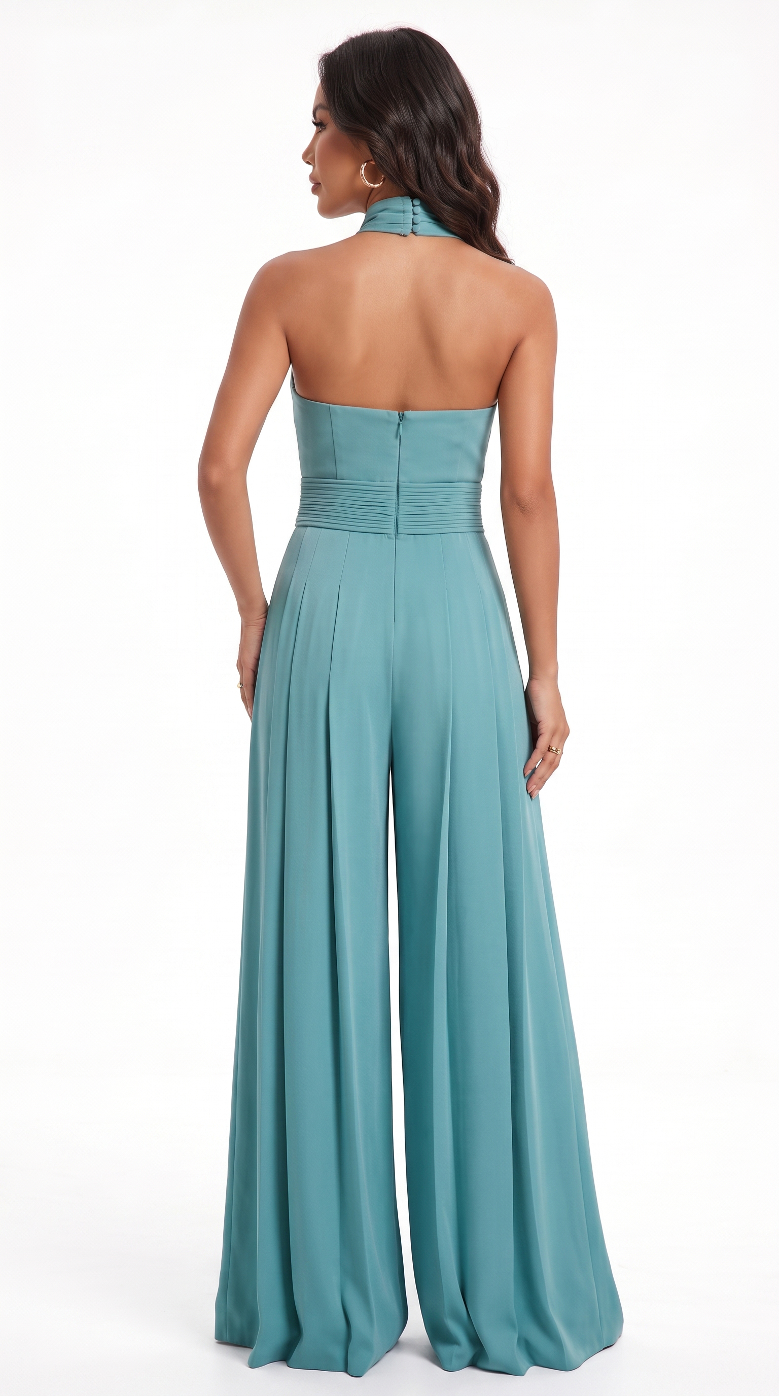 A woman modeling a teal halter-neck wide-leg jumpsuit from the back, shown against a plain white studio background, from Meleche Fashion USA or Meléche (short as (Mé))