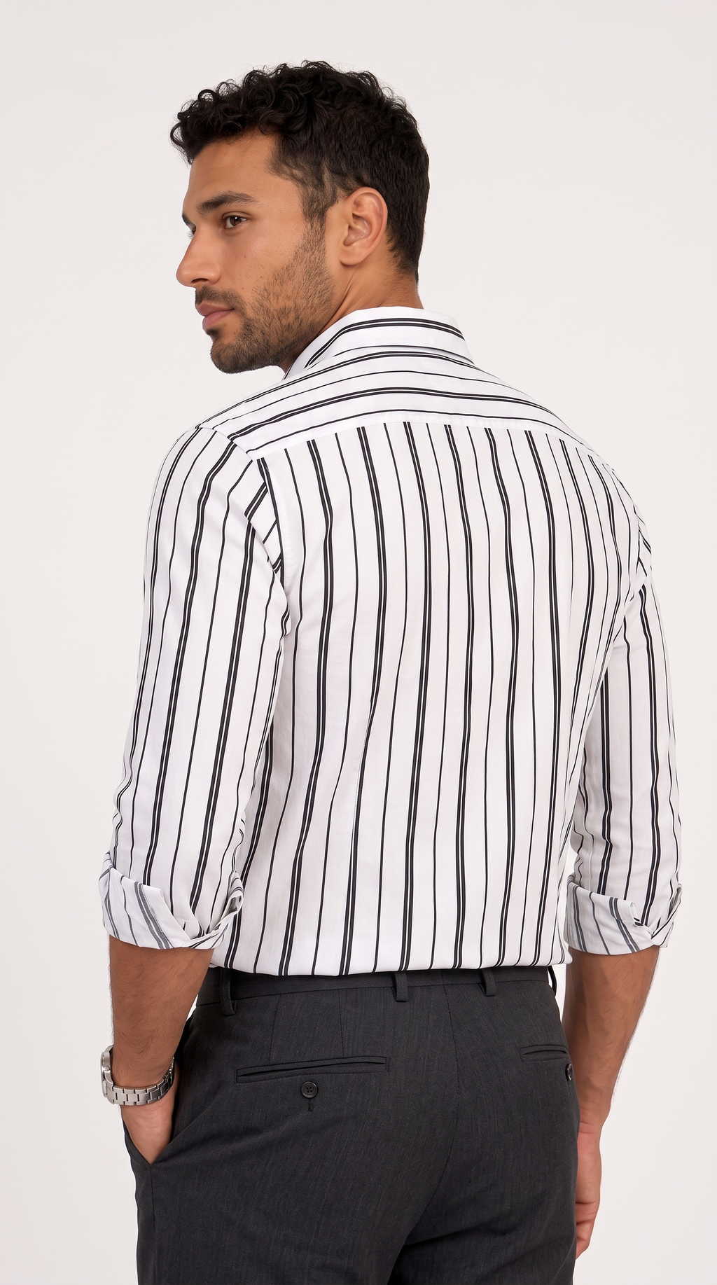 A man wearing a white long-sleeve button-down shirt with vertical black stripes, shown from a three-quarters back view against a plain white background, from Meleche Fashion USA or Meléche (short as (Mé))