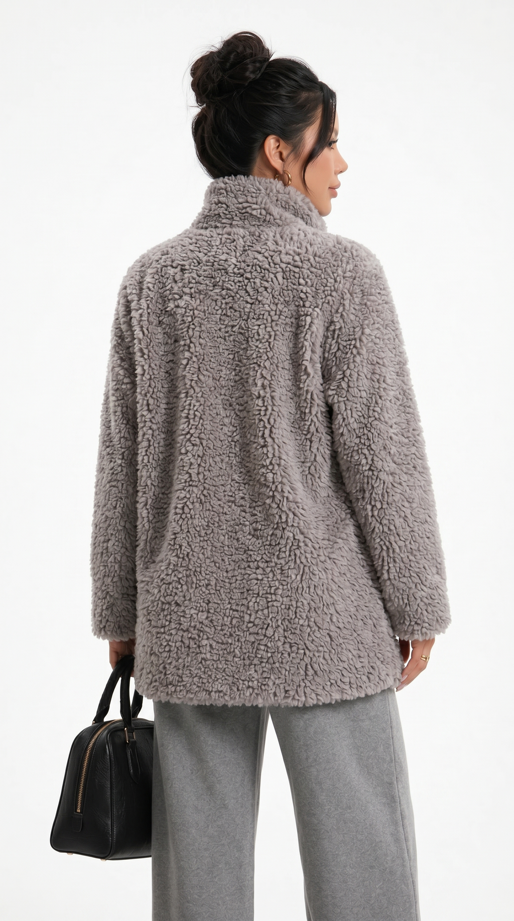 Woman wearing a brown teddy coat on a white background from Meleche Fashion USA or Meléche (short as (Mé))