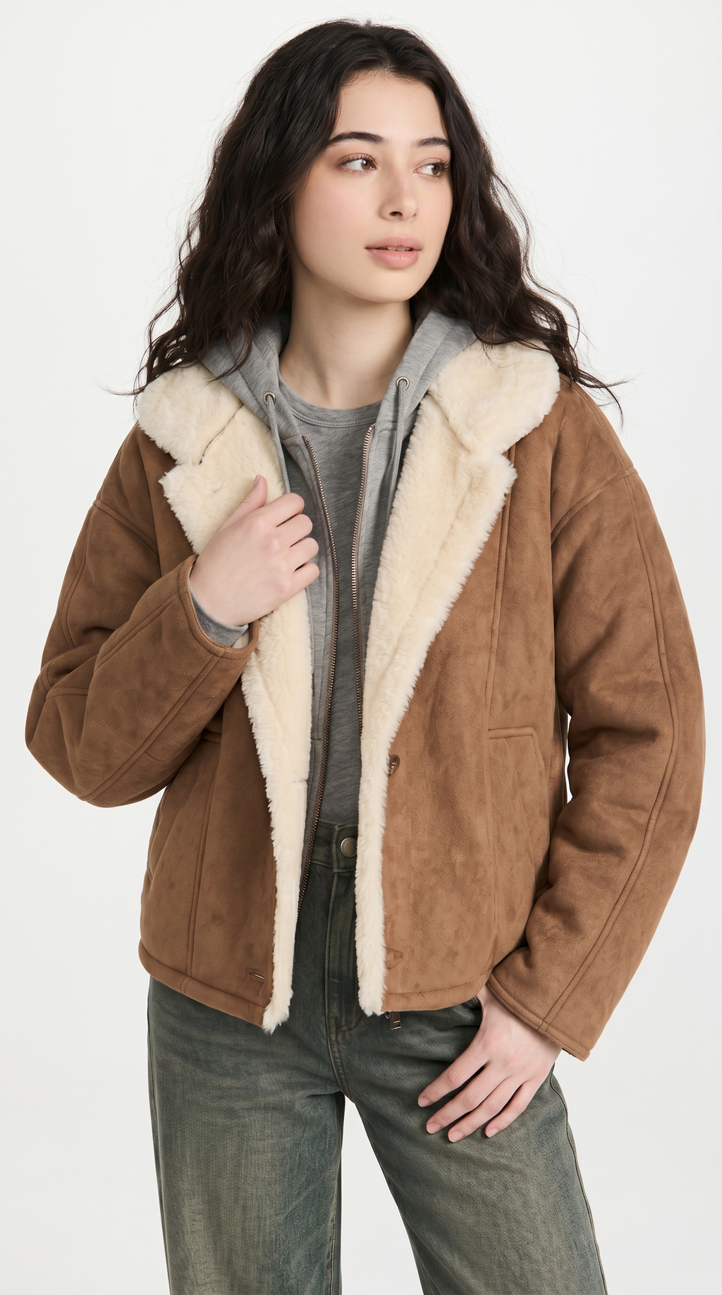 Woman wearing a brown jacket with white fur lining on a white background from Meleche or Meléche USA (short as (Mé))