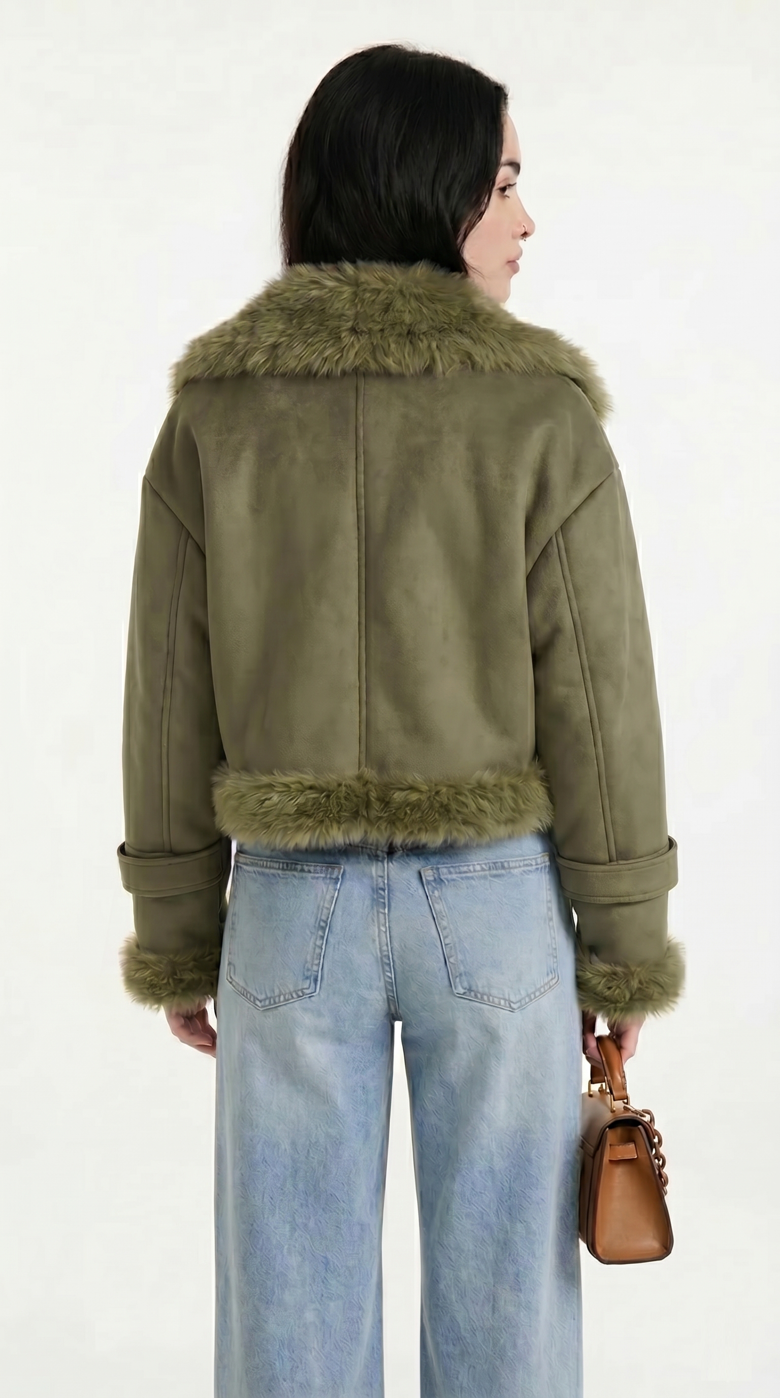 Person wearing an olive green jacket with fur trim on a white background from Meleche USA or Meléche (short as (Mé))