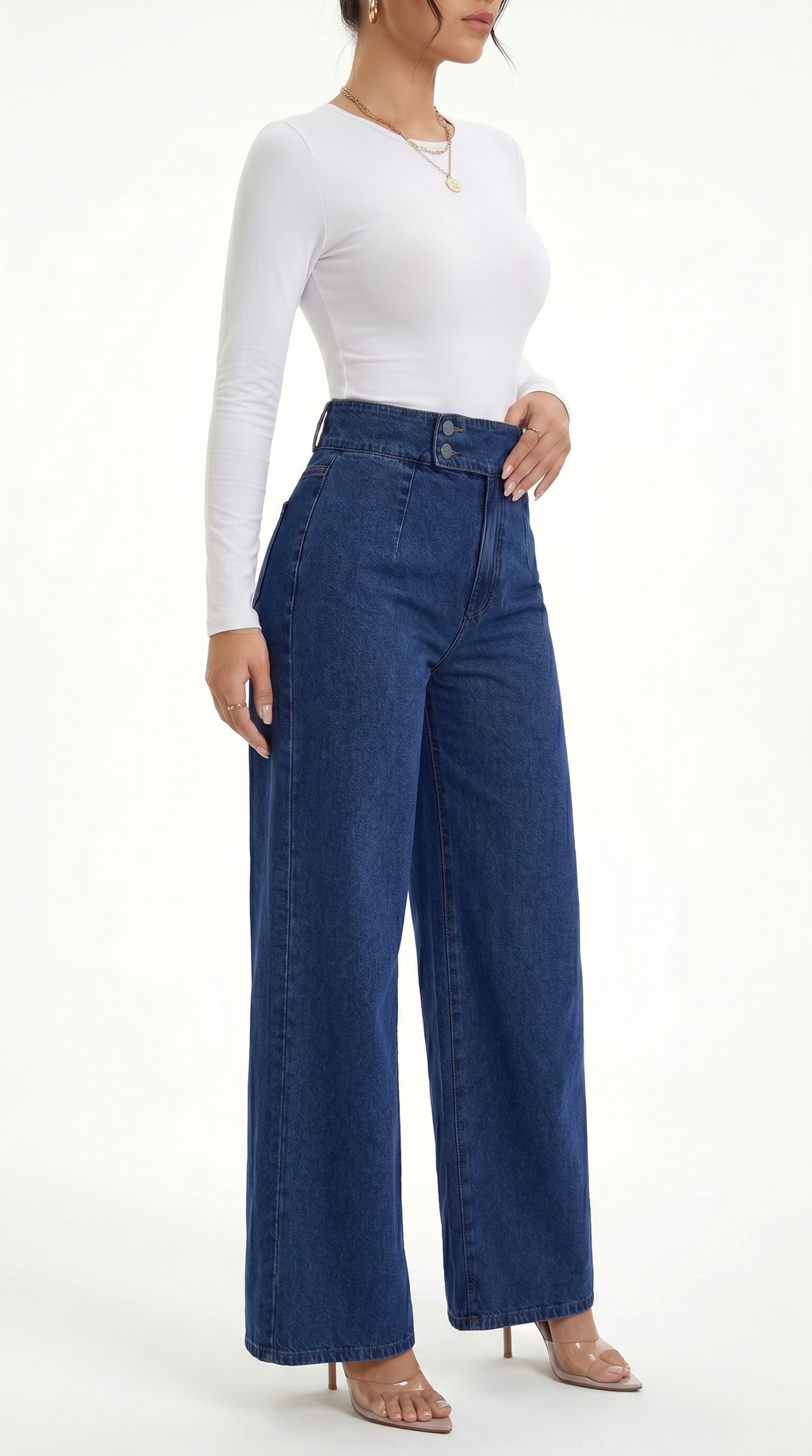 Person wearing a white long-sleeve top and blue wide-leg jeans on a white background, Straight Leg jeans from Meleche Fashion USA or Meléche (short as (Mé))