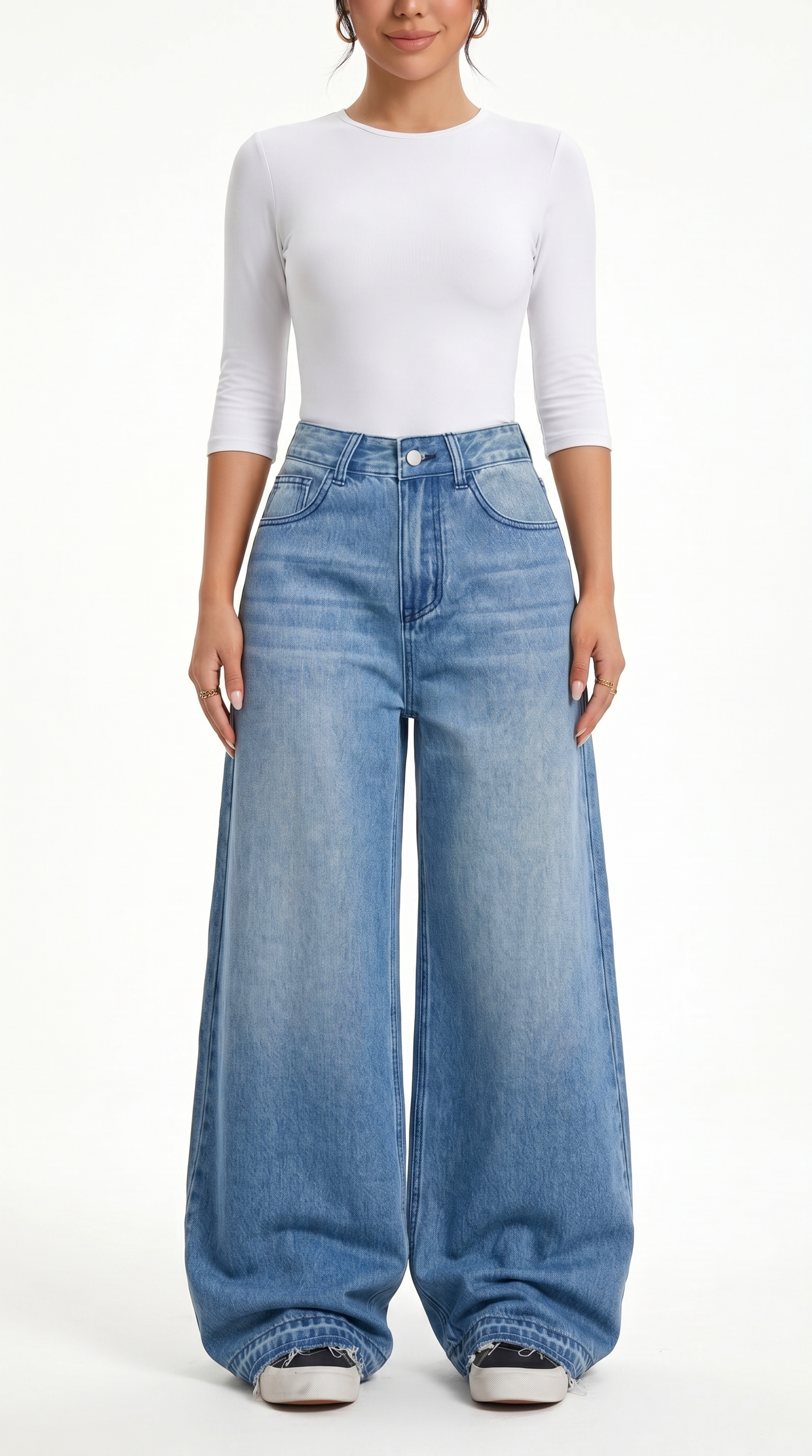 Person wearing a white top and blue wide-leg jeans on a white background, Wide-leg Egyptian Cotton jeans from Meleche Fashion USA or Meléche (short as (Mé))