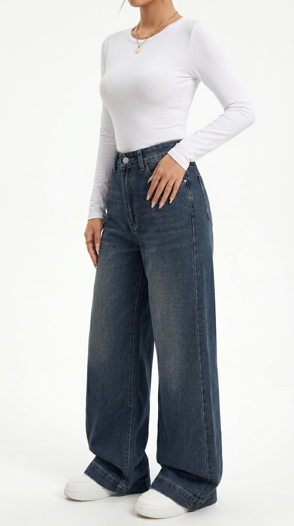Person wearing a white long-sleeve top and blue jeans on a white background , wide jeans from Meleche Fashion USA or Meléche (short as (Mé))
