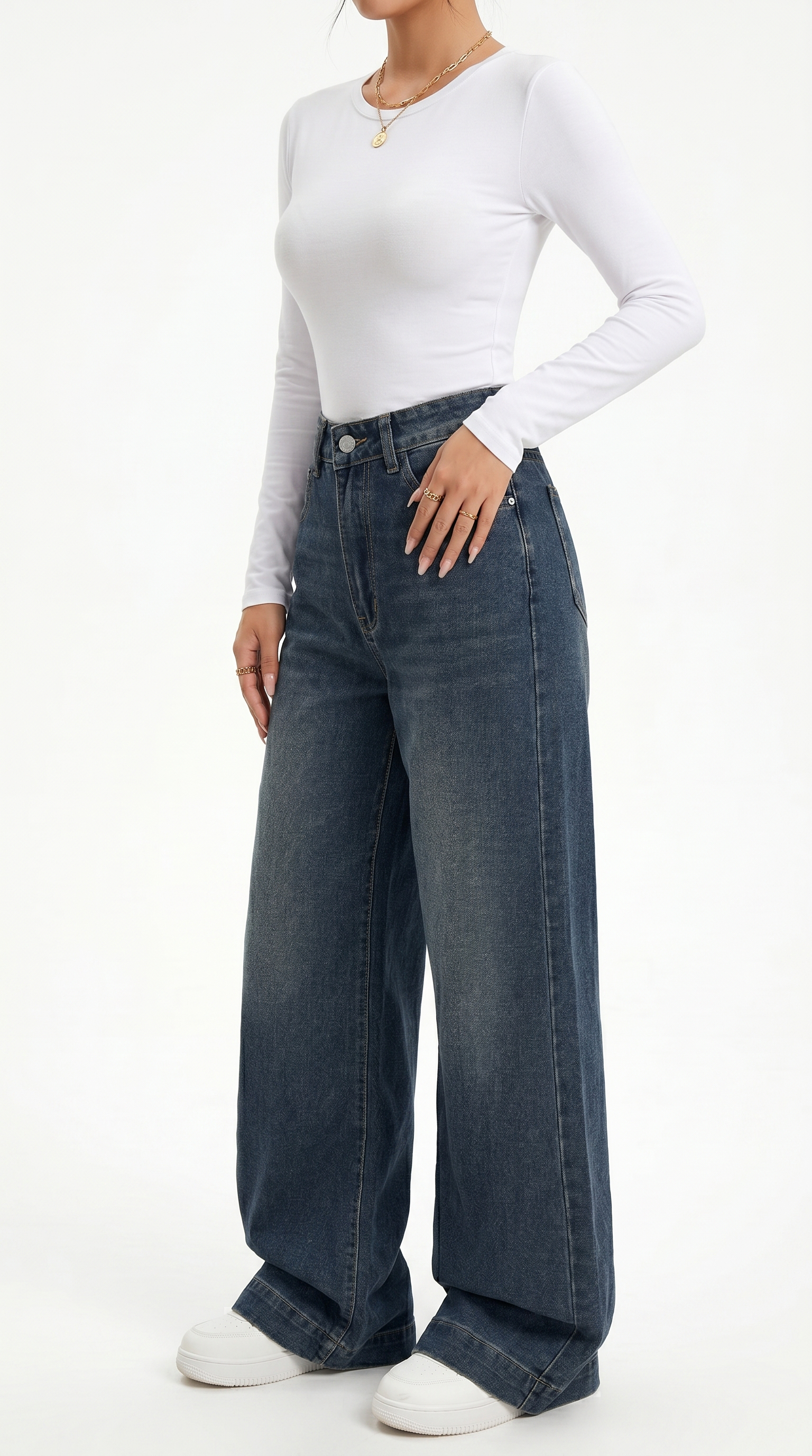Person wearing a white long-sleeve top and blue jeans on a white background , wide jeans from Meleche Fashion USA or Meléche (short as (Mé))