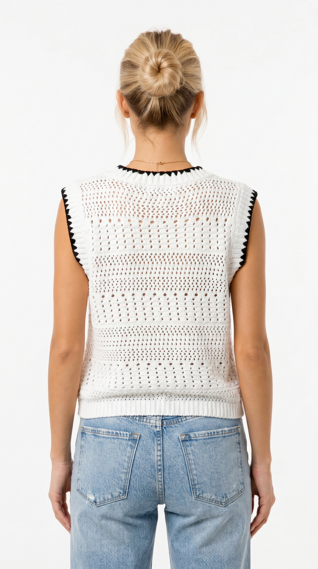 Isla girl wearing a white crochet vest with black accents on a plain background from Meleche Fashion USA or Meléche (short as (Mé))