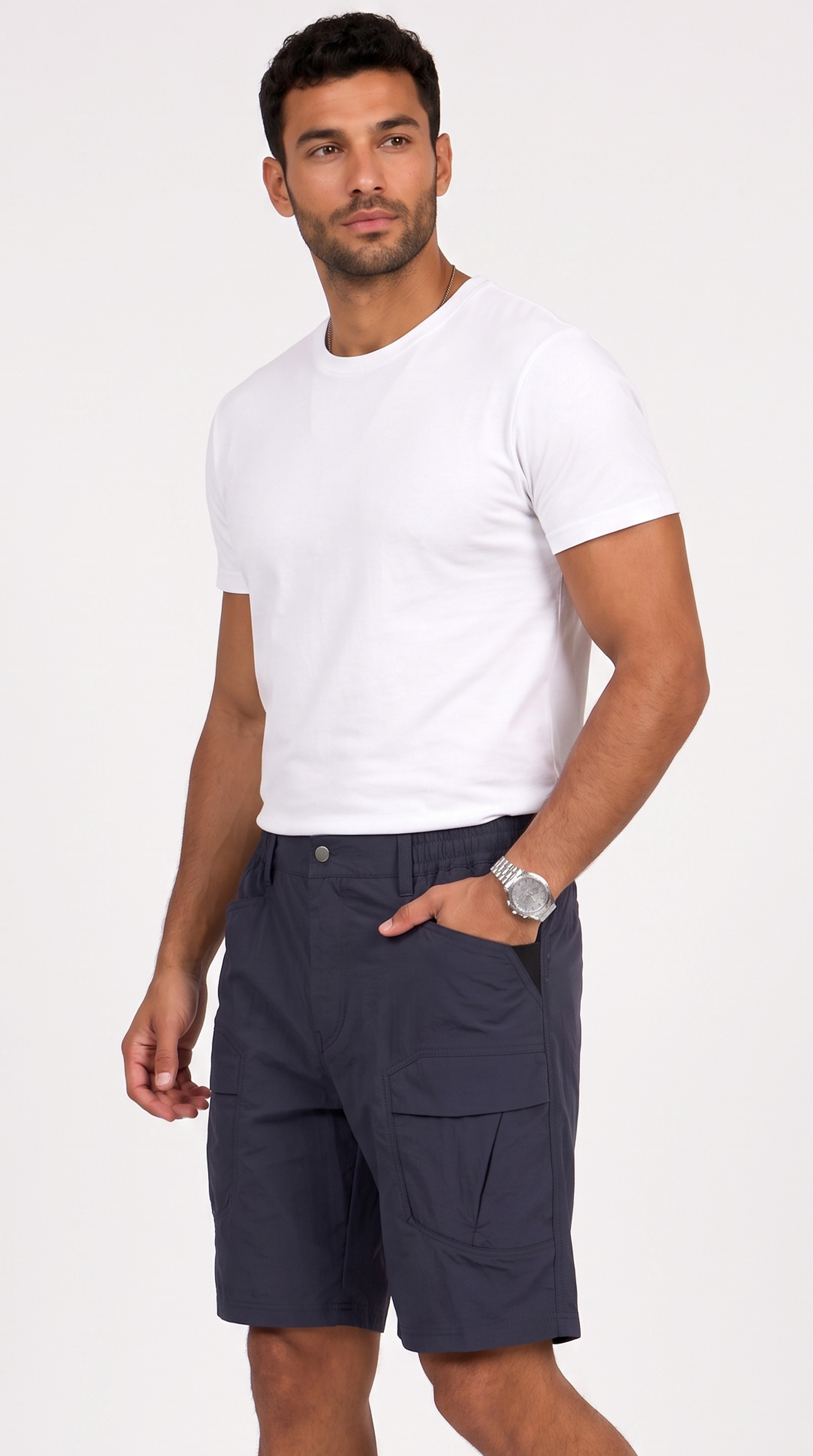 A man wearing a plain white short-sleeve crewneck t-shirt and dark navy cargo shorts, standing against a light gray studio background, from Meleche Fashion USA or Meléche (short as (Mé))