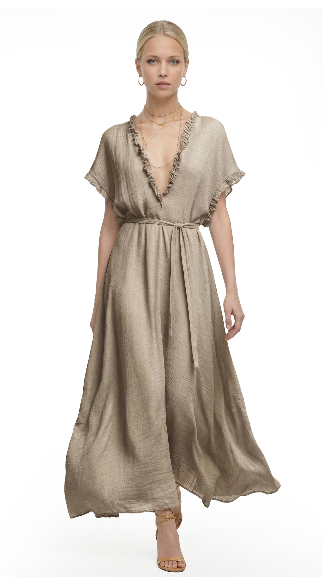 Woman wearing a beige dress with a white background