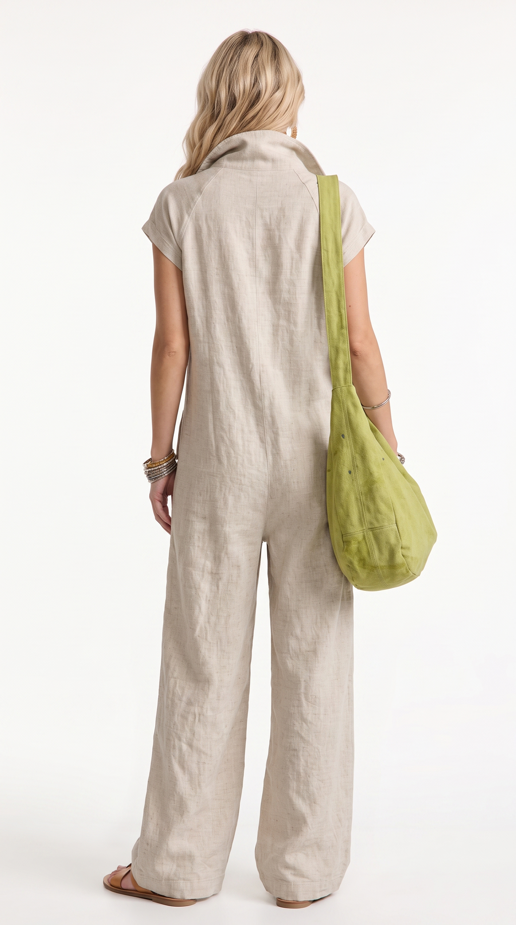 A woman shown from the back wearing a light beige linen jumpsuit and carrying a lime green shoulder bag against a plain white background, from Meleche Fashion USA or Meléche (short as (Mé))