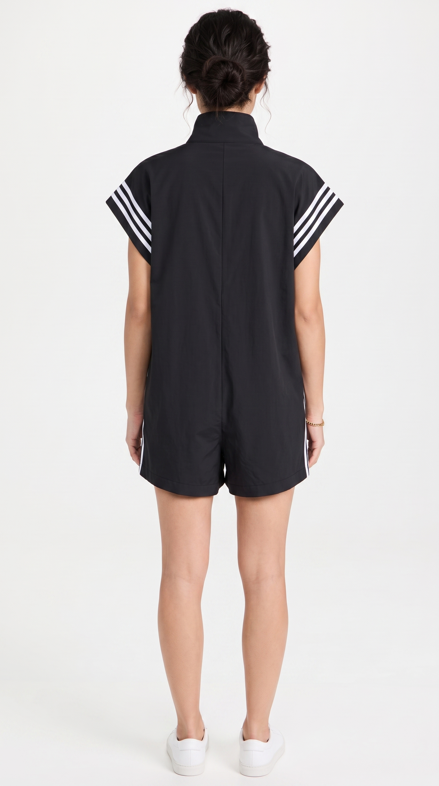 Black romper with white stripes on sleeves against a white background, from Meleche Fashion USA or Meléche (short as (Mé))
