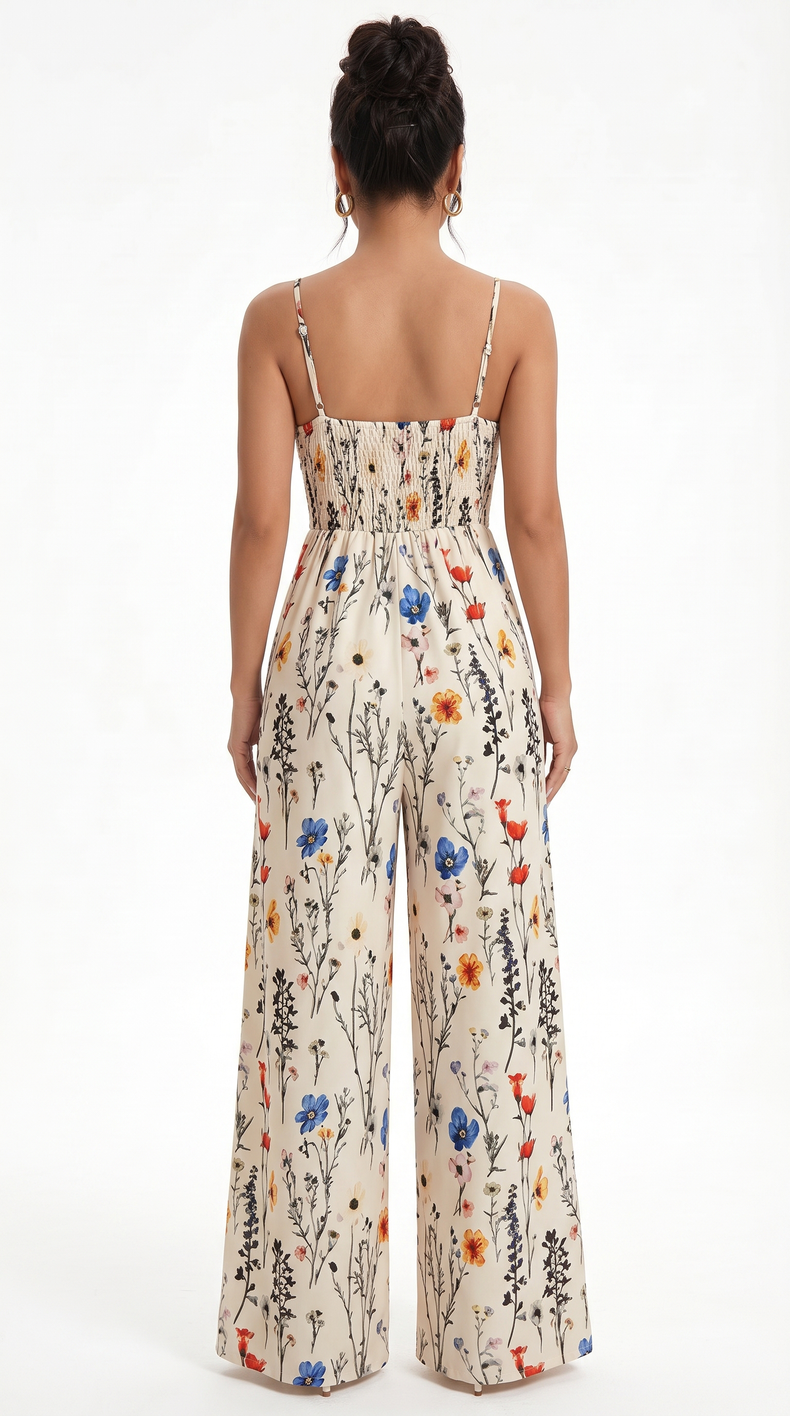 Woman wearing a floral jumpsuit on a white background, from Meleche Fashion USA or Meléche (short as (Mé))