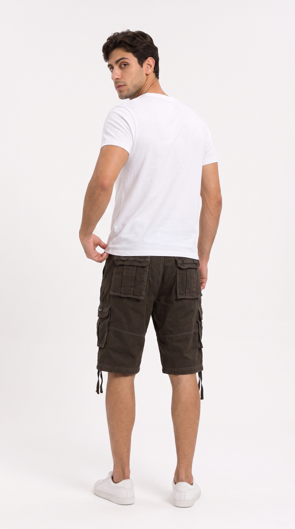A man wearing dark brown cargo shorts and a white t-shirt, shown from a rear three-quarter view against a plain white studio background, from Meleche Fashion USA or Meléche (short as (Mé))