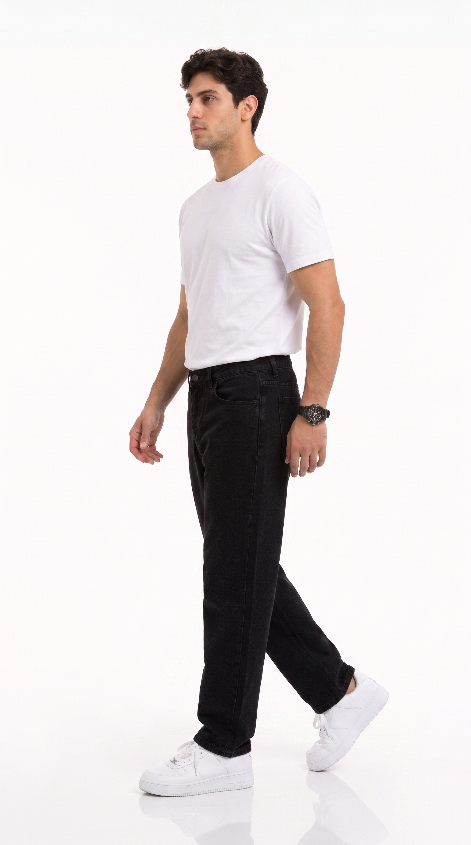 A man in a white t-shirt, black jeans, and white sneakers walking in profile against a clean white studio background, from Meleche Fashion USA or Meléche (short as (Mé))