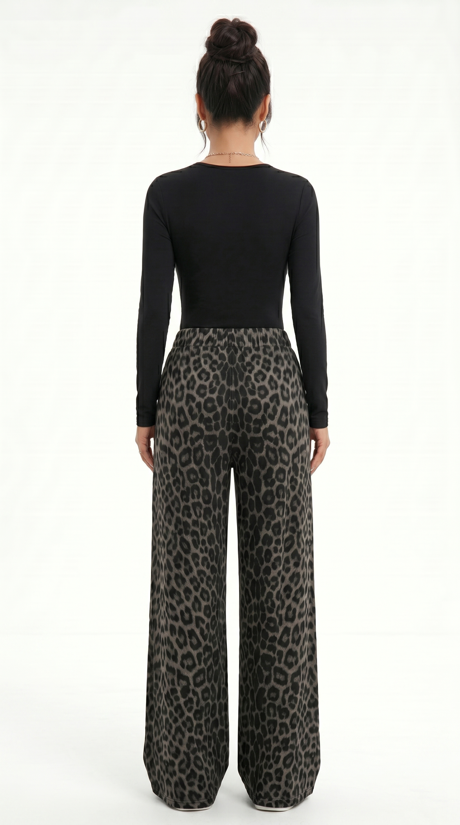 Person wearing a black long-sleeve top and leopard print pants on a white background, sexy pants from Meleche Fashion USA or Meléche (short as (Mé))