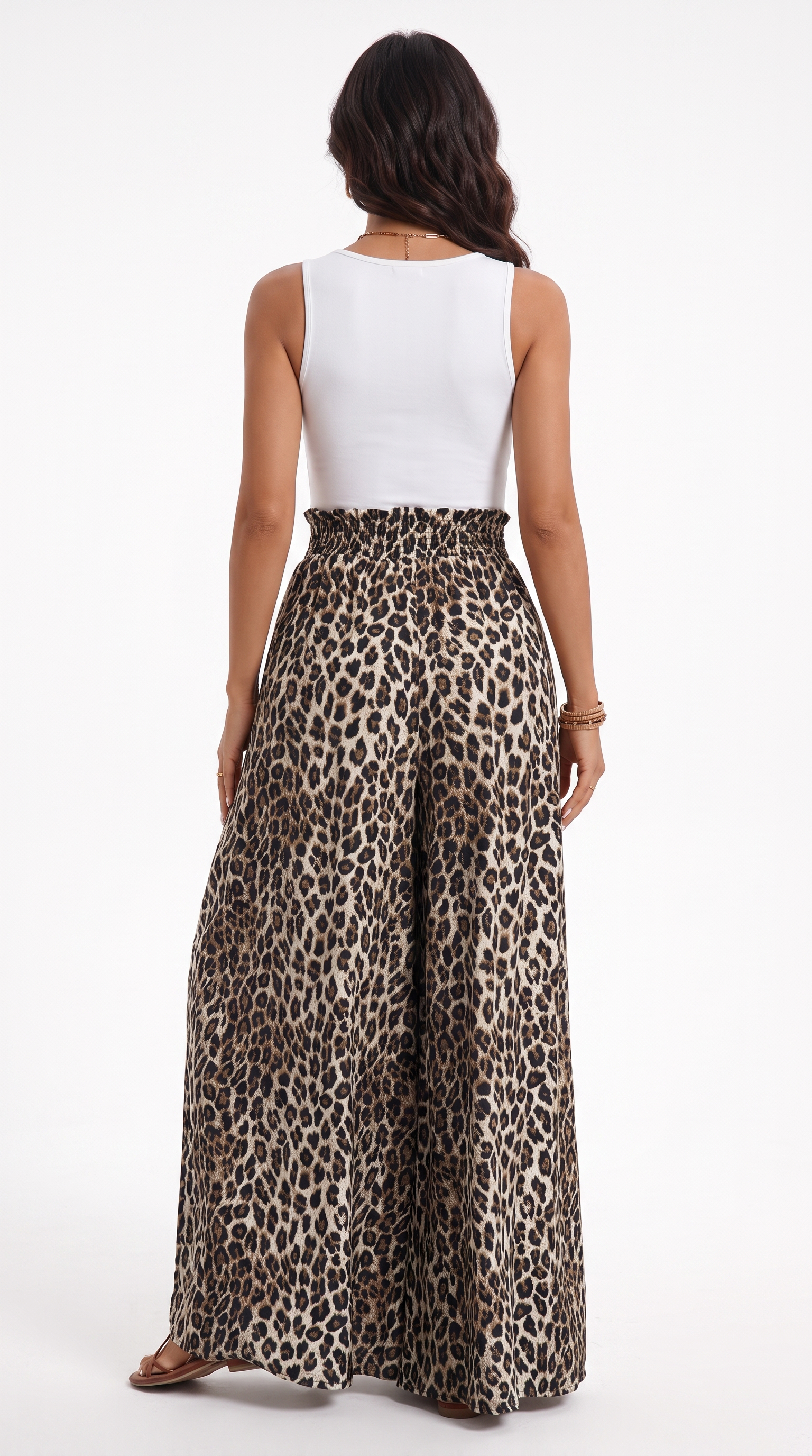 A woman shown from the back wearing a white sleeveless top and high-waisted leopard-print wide-leg pants against a plain white studio background.