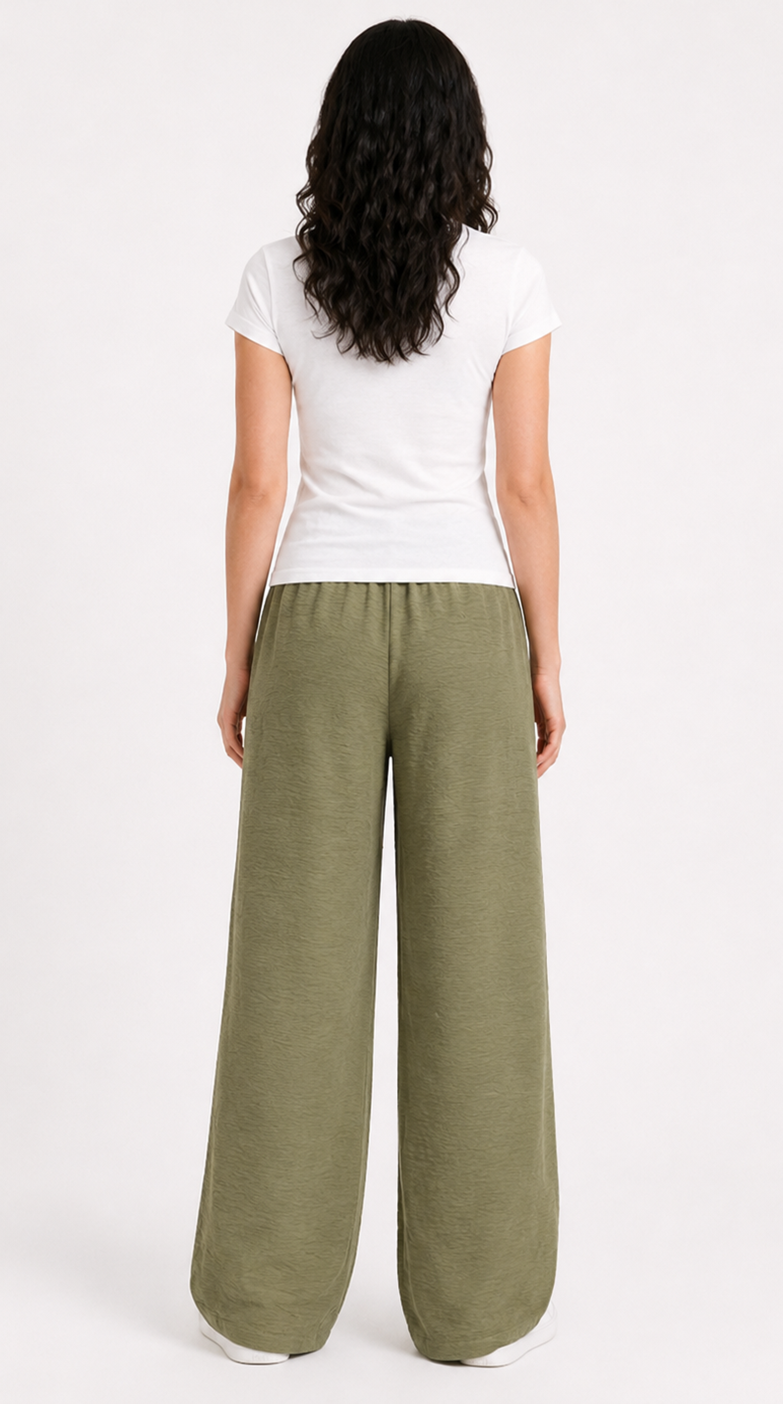 Woman wearing a white top and green wide-leg pants loss-fit on a white background, from Meleche Fashion USA or Meléche (short as (Mé))