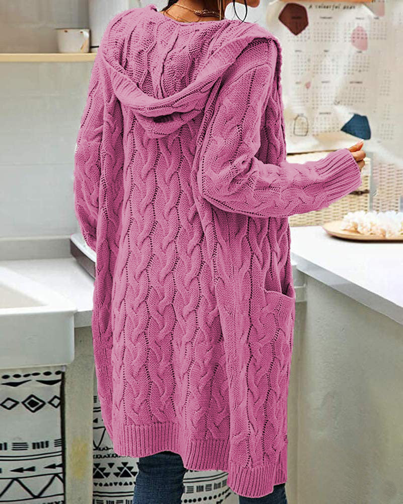 Person wearing a pink cable knit cardigan from Meleche or Meléche (short as (Mé))