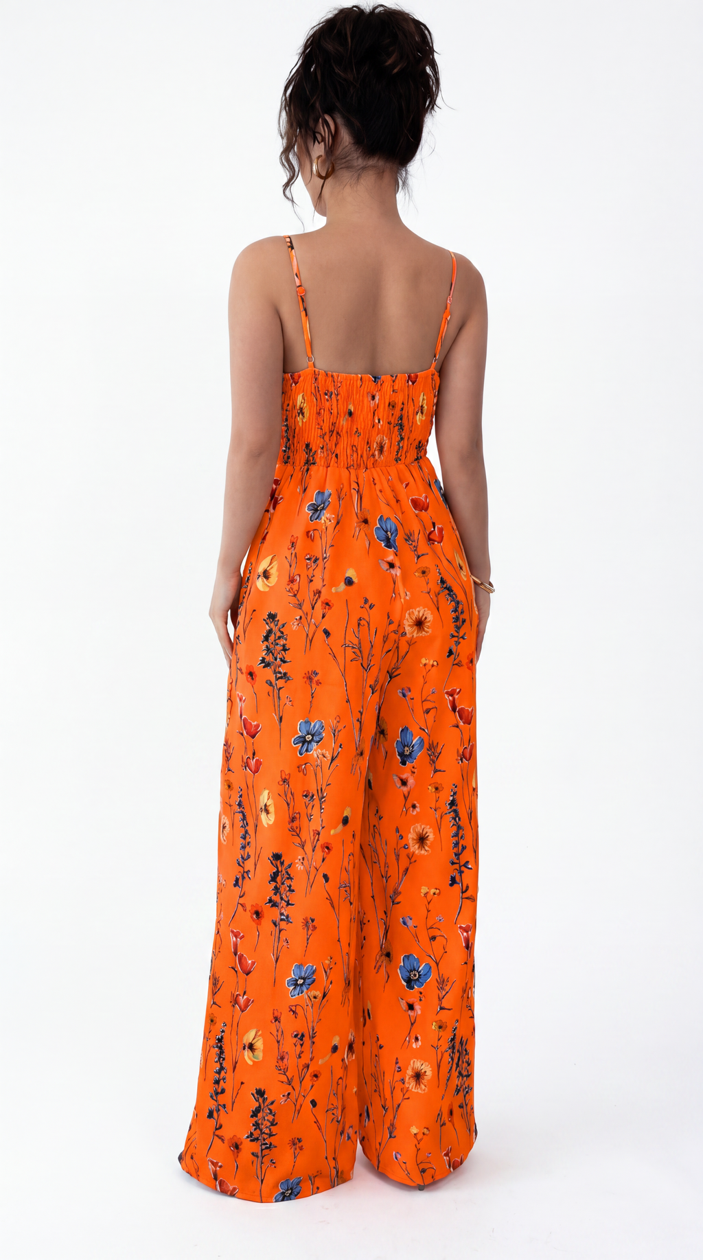 Orange floral jumpsuit worn by a model on a white background, from Meleche Fashion USA or Meléche (short as (Mé))
