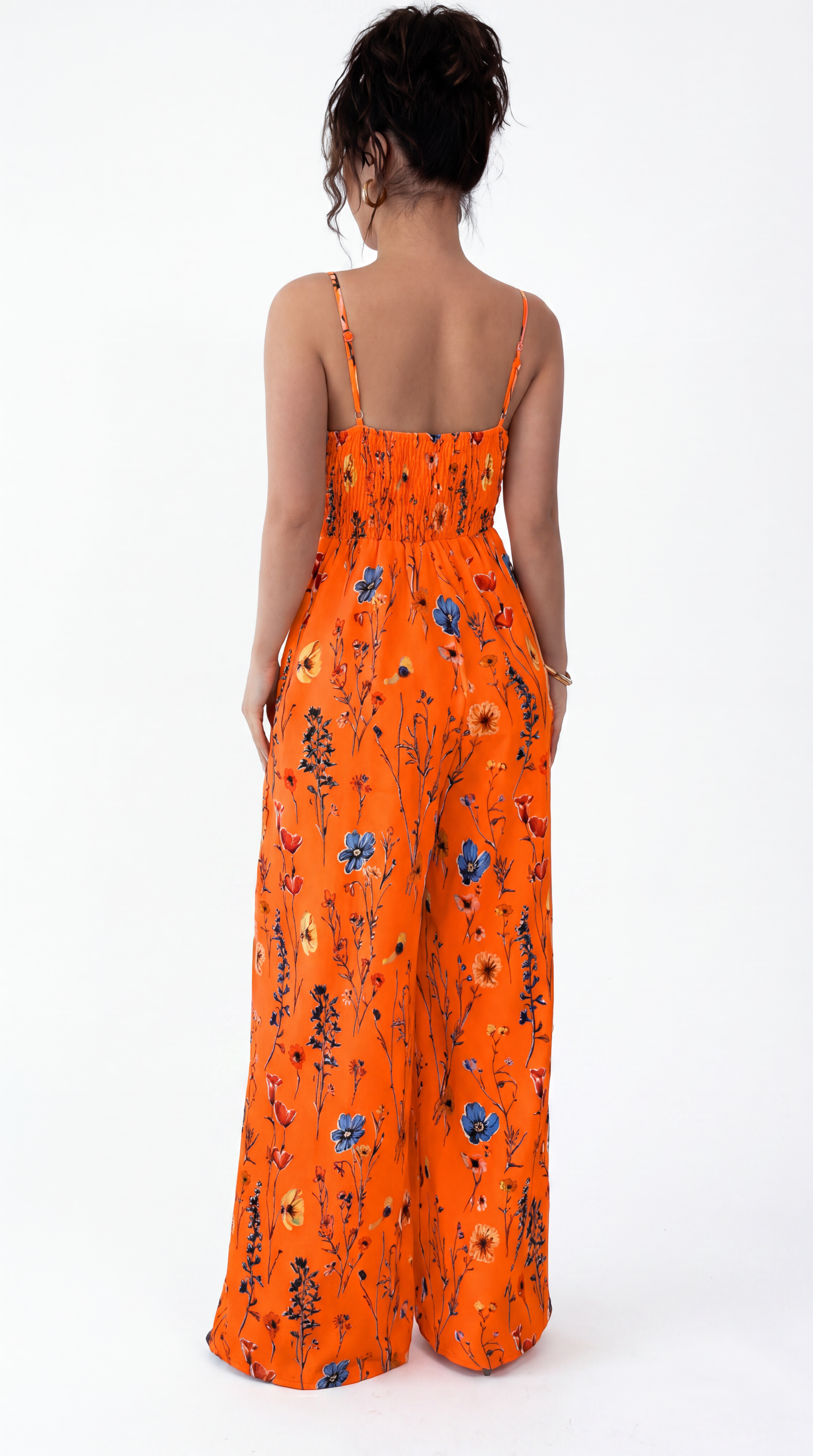 Orange floral jumpsuit worn by a model on a white background, from Meleche Fashion USA or Meléche (short as (Mé))