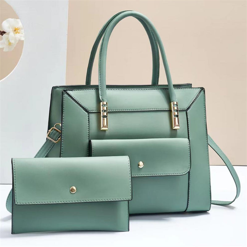 Jannik - Green handbag and matching wallet on a light background 
