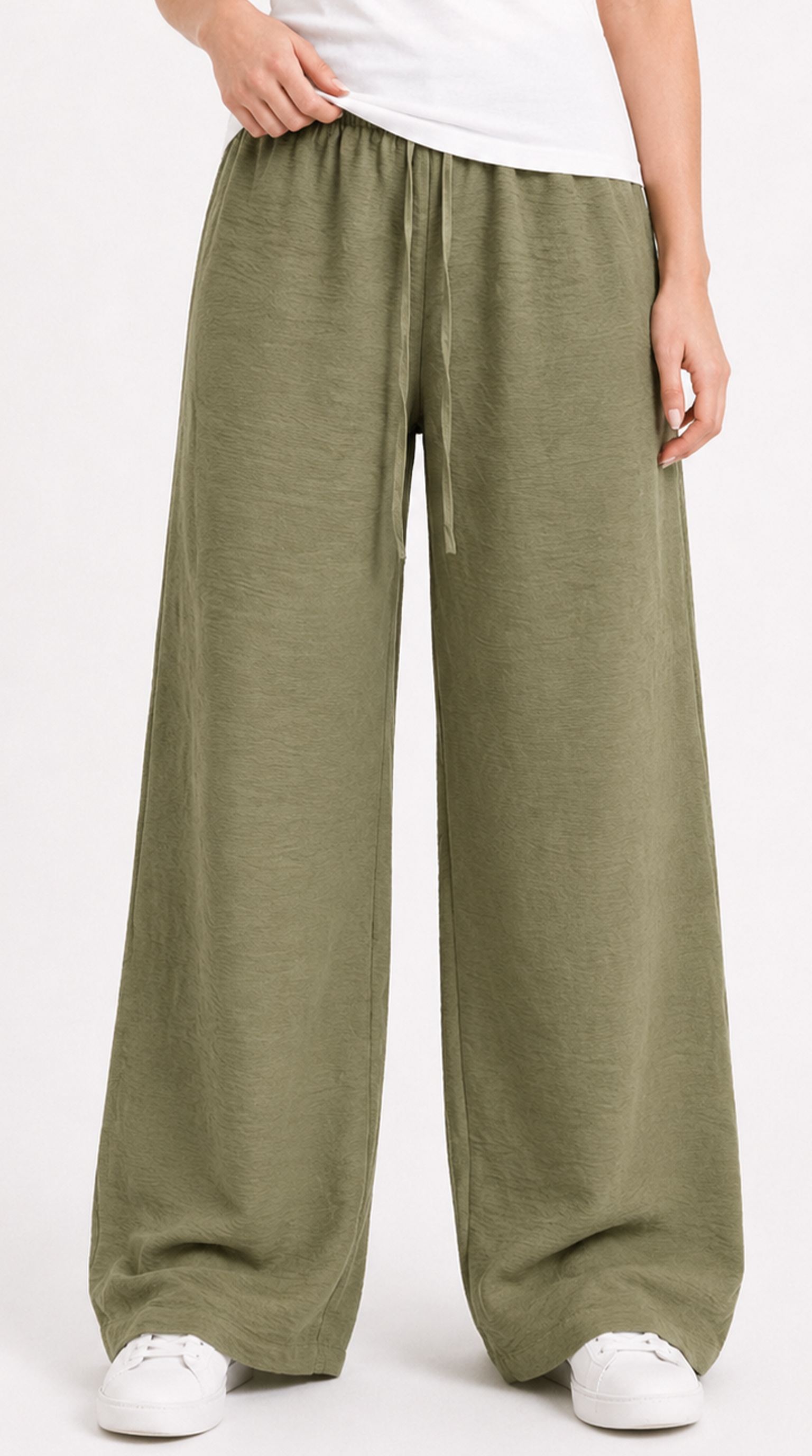 Person wearing olive green wide-leg pants on a white background, from Meleche Fashion USA or Meléche (short as (Mé))