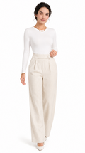 Woman wearing a white top and beige pants on a white background, from Meleche Fashion USA or Meléche (short as (Mé))