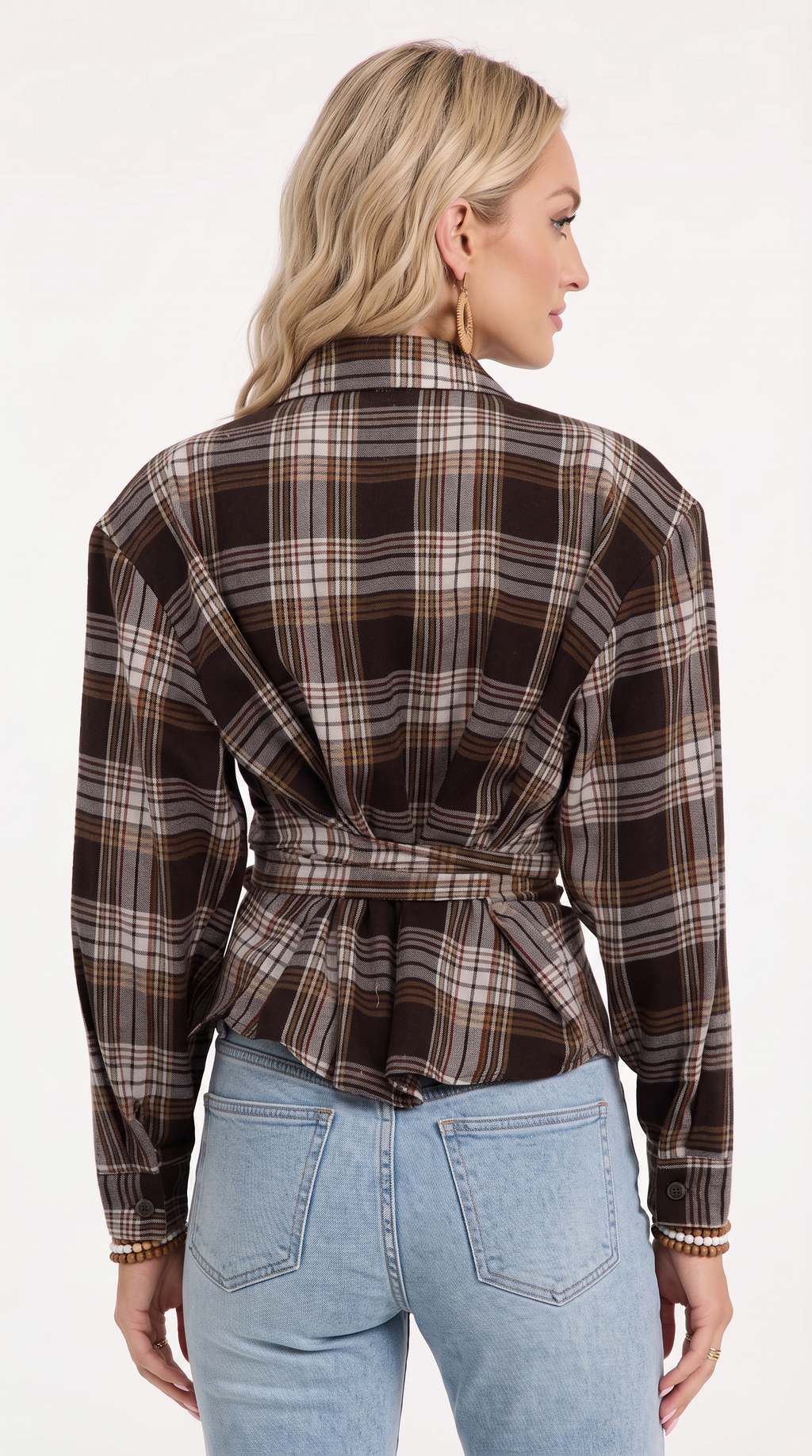 A woman shown from the back wearing a long-sleeve plaid wrap-style blouse in dark brown, beige, and black, paired with light blue jeans, against a plain white studio background, from Meleche Fashion USA or Meléche (short as (Mé))