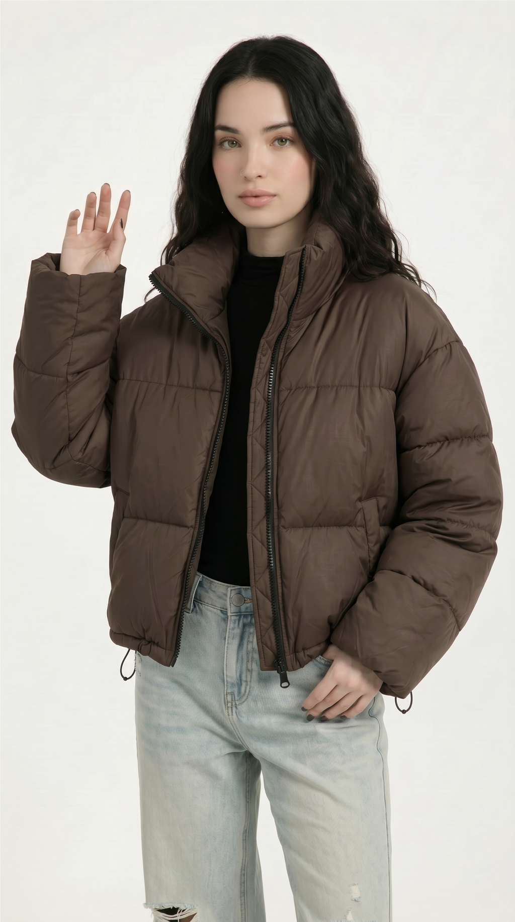 Woman wearing a brown puffer jacket on a white background from Meleche or Meléche USA (short as (Mé))