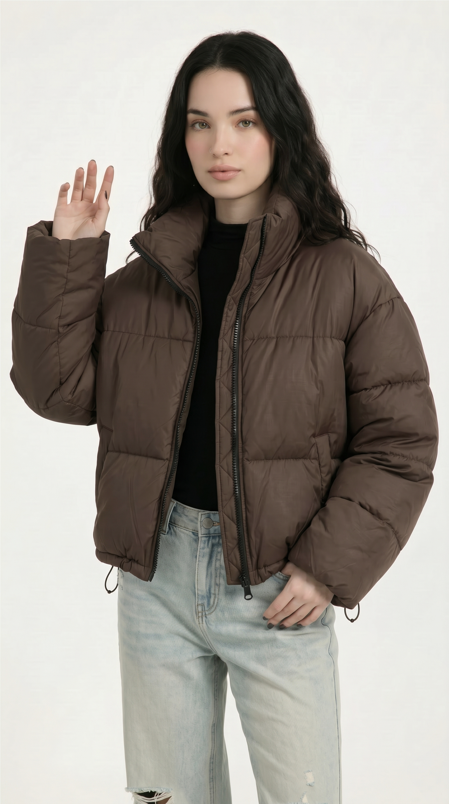 Woman wearing a brown puffer jacket on a white background from Meleche or Meléche USA (short as (Mé))