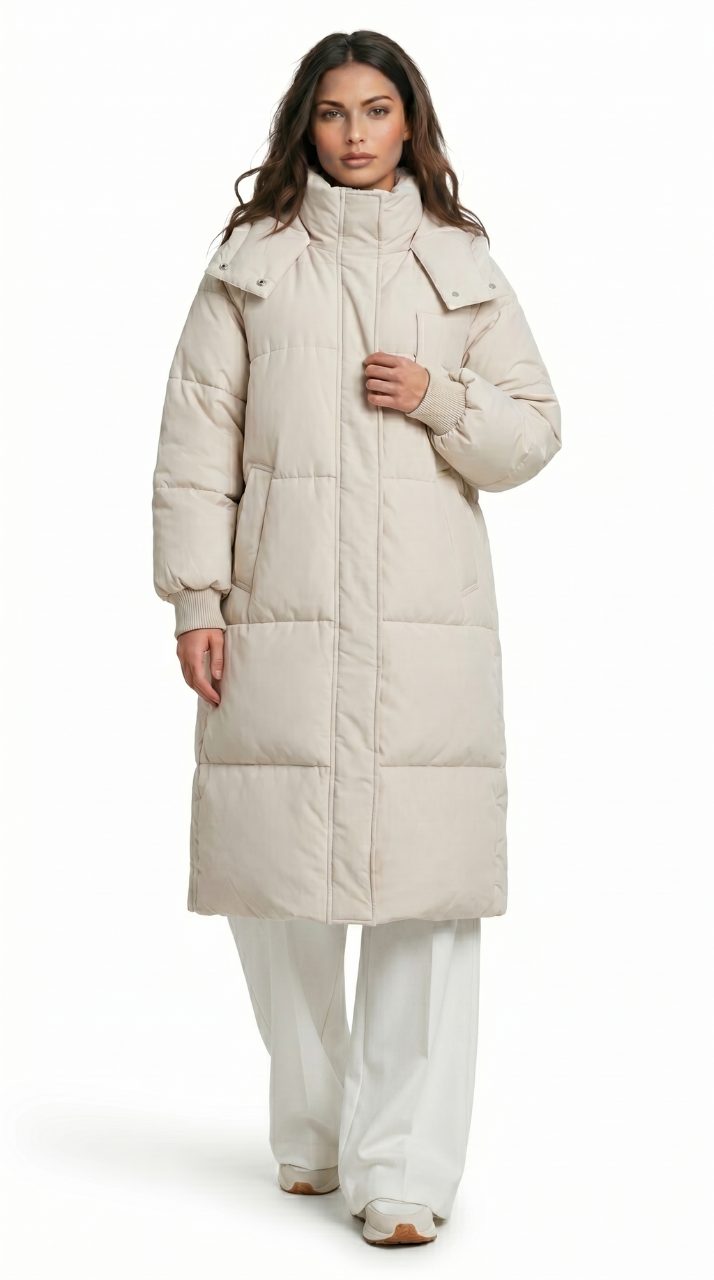 Woman wearing a long beige puffer coat on a white background from Meleche Fashion USA or Meléche (short as (Mé))
