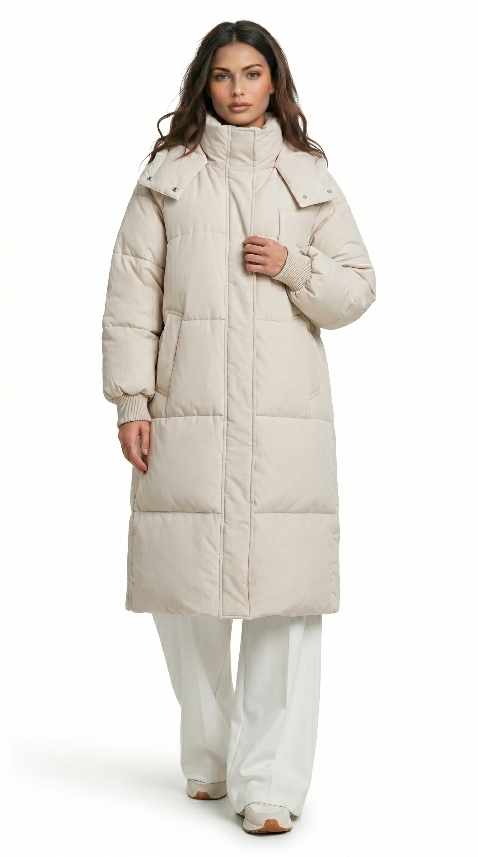 Woman wearing a long beige puffer coat on a white background from Meleche Fashion USA or Meléche (short as (Mé))