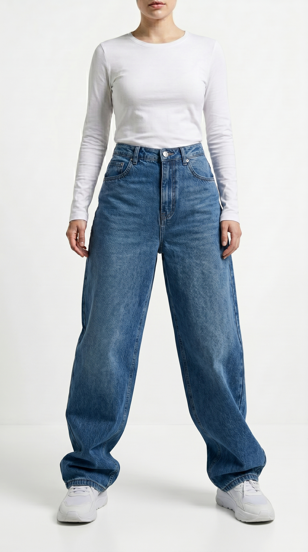 Person wearing a white long-sleeve shirt and blue jeans on a white background, Relaxed Fit Egyptian cotton jeans from Meleche Fashion USA or Meléche (short as (Mé))